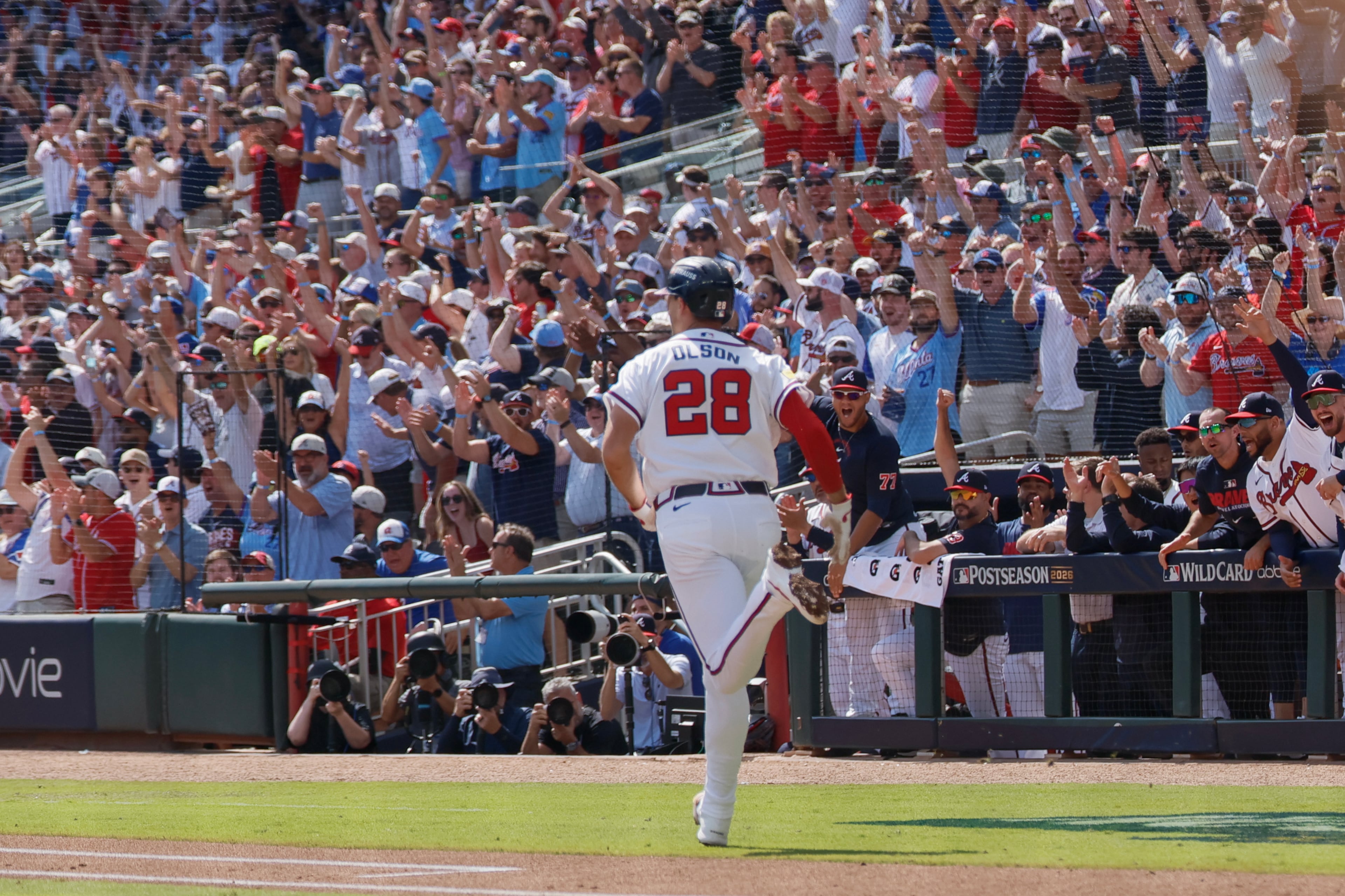 Fans cheers after Braves first baseman Matt Olson hits an RBI single against the Phillies during Game 2 of their National League Wild Card Series on Wednesday, Sept. 30, 2026, at Truist Park in Atlanta. (Miguel Martinez/AJC)