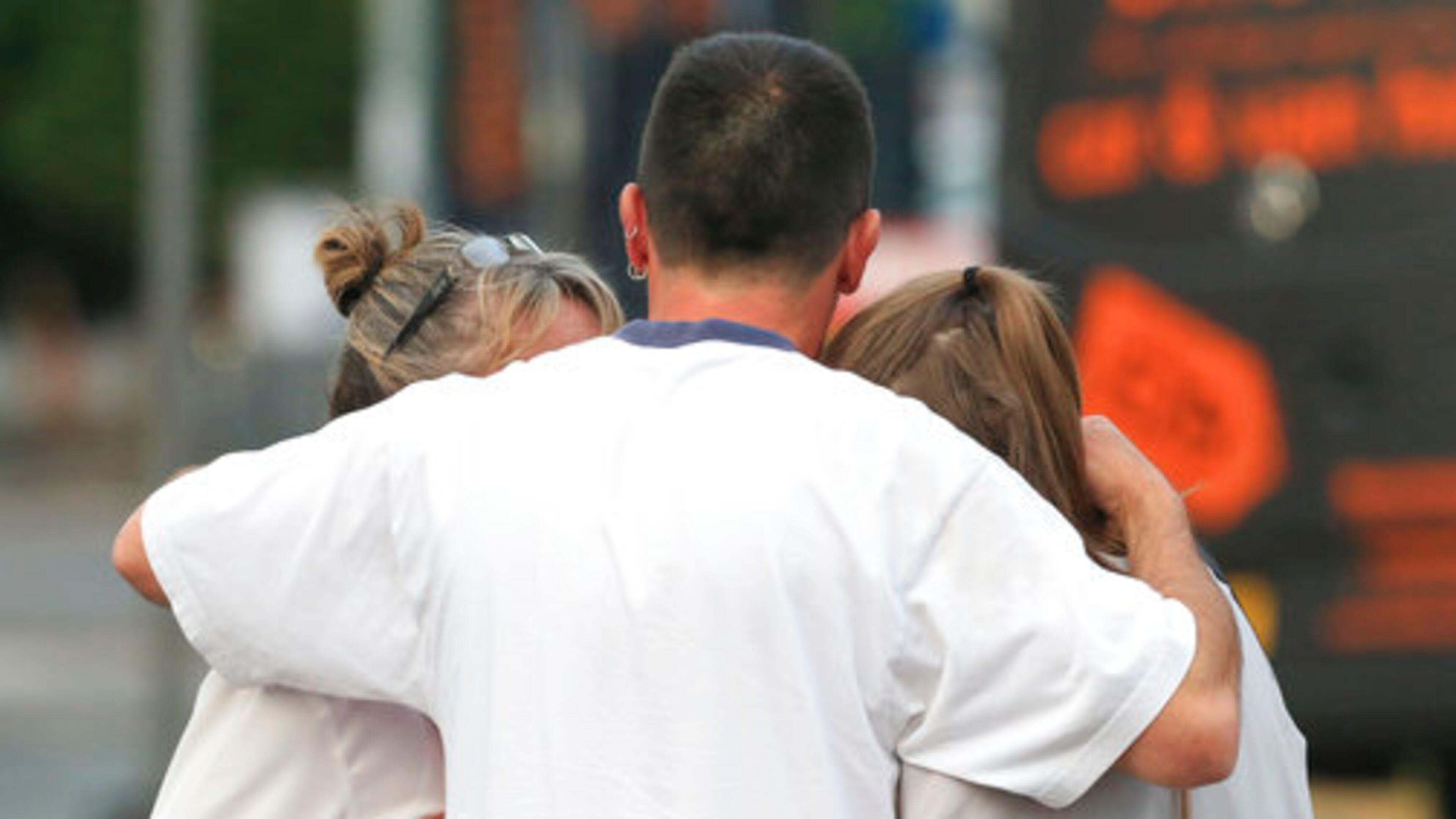 Fans leave the Park Inn hotel in central Manchester, England Tuesday May 23 2017. An apparent suicide bomber set off an improvised explosive device that killed over a dozen people at the end of an Ariana Grande concert on Monday, Manchester police said Tuesday. (AP Photo/Rui Vieira)