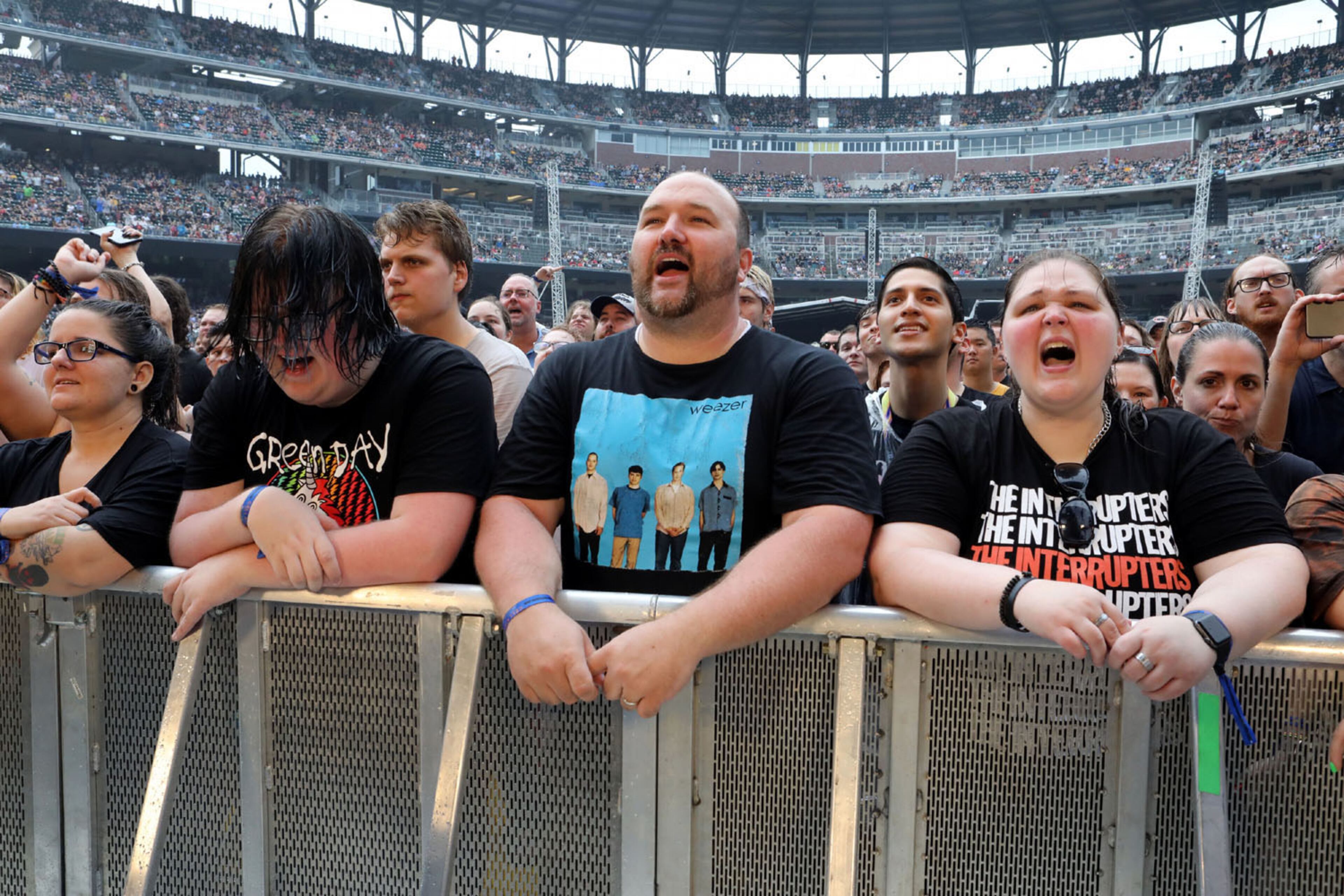 Green Day, Fall Out Boy and Weezer rocked out Truist Park on Tuesday, July 27, 2021 on the Hella Mega Tour.
An estimated 40,000 concert fans celebrated the return of live music and even early rains could not dampen the festive atmosphere at the Braves stadium.
Robb Cohen for the Atlanta Journal-Constitution