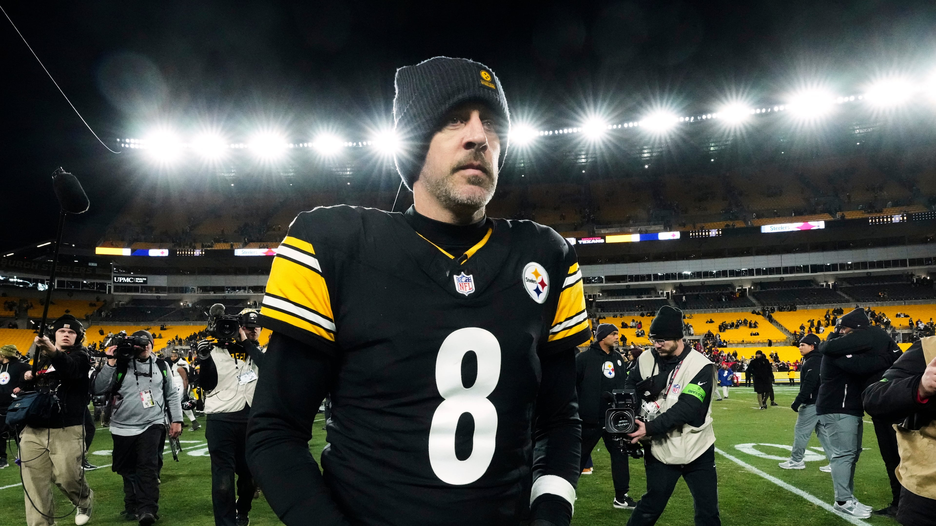 FILE - Pittsburgh Steelers quarterback Aaron Rodgers (8) leaves the field after an NFL wild-card playoff football game against the Houston Texans, Monday, Jan. 12, 2026, in Pittsburgh. (AP Photo/Gene J. Puskar,File)
