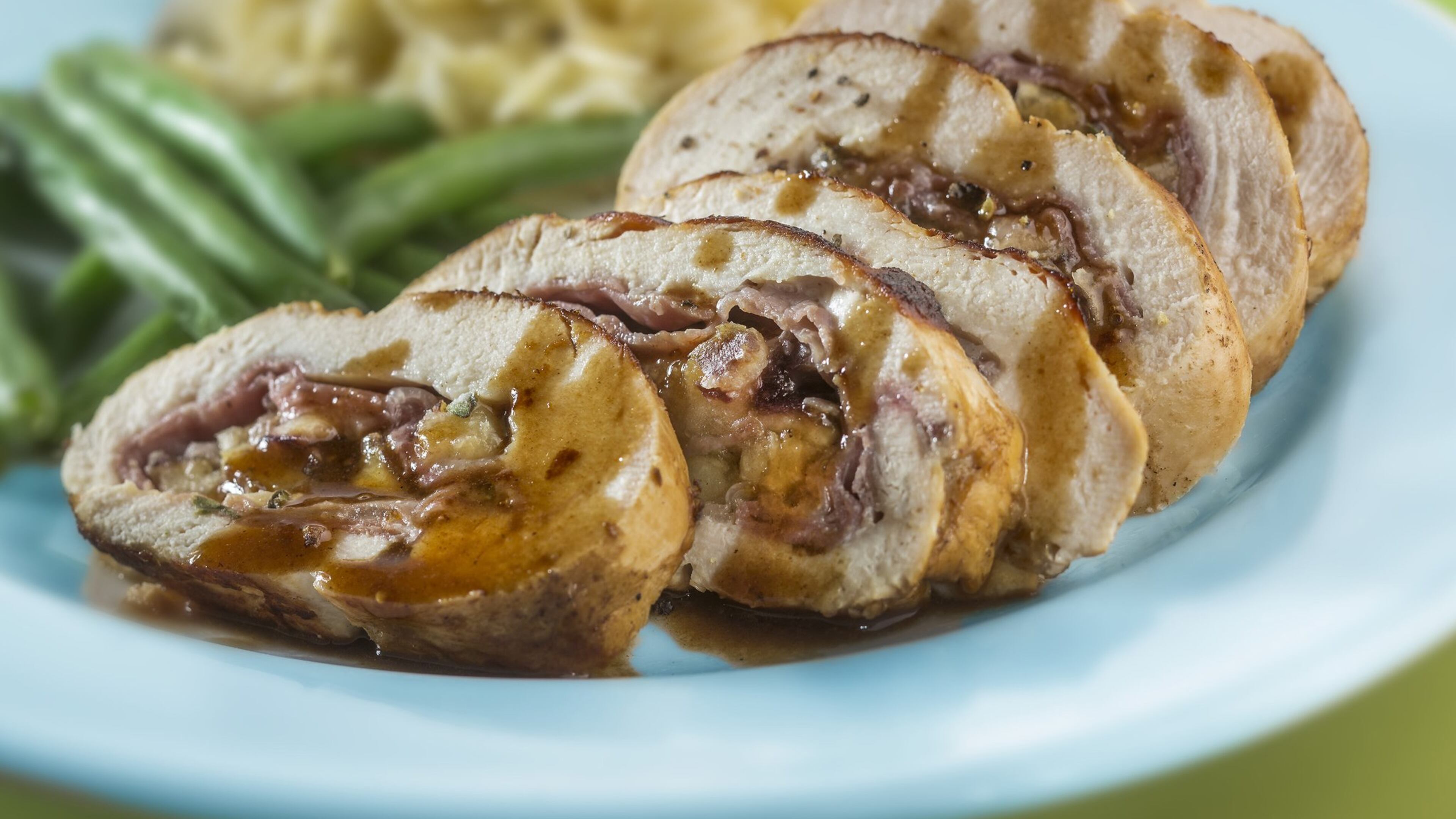 A butter-enriched wine sauce coats fig- and cheese-stuffed chicken. (Bill Hogan/Chicago Tribune/TNS)
