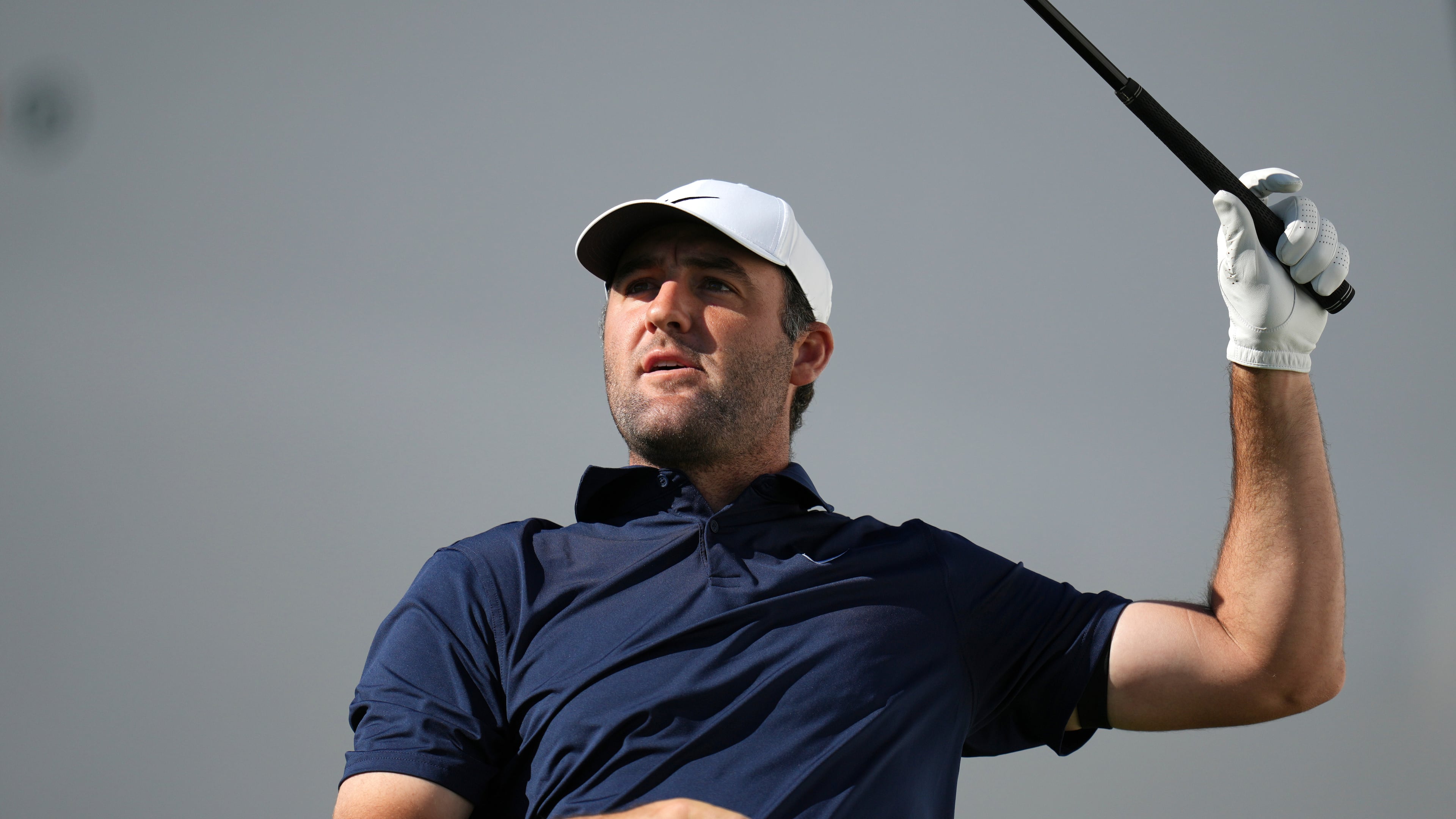 Scottie Scheffler watches his tee shot at the 17th hole during the first round of the Phoenix Open golf tournament at the TPC Scottsdale Stadium Course Thursday, Feb. 5, 2026, in Scottsdale, Ariz. (AP Photo/Ross D. Franklin)