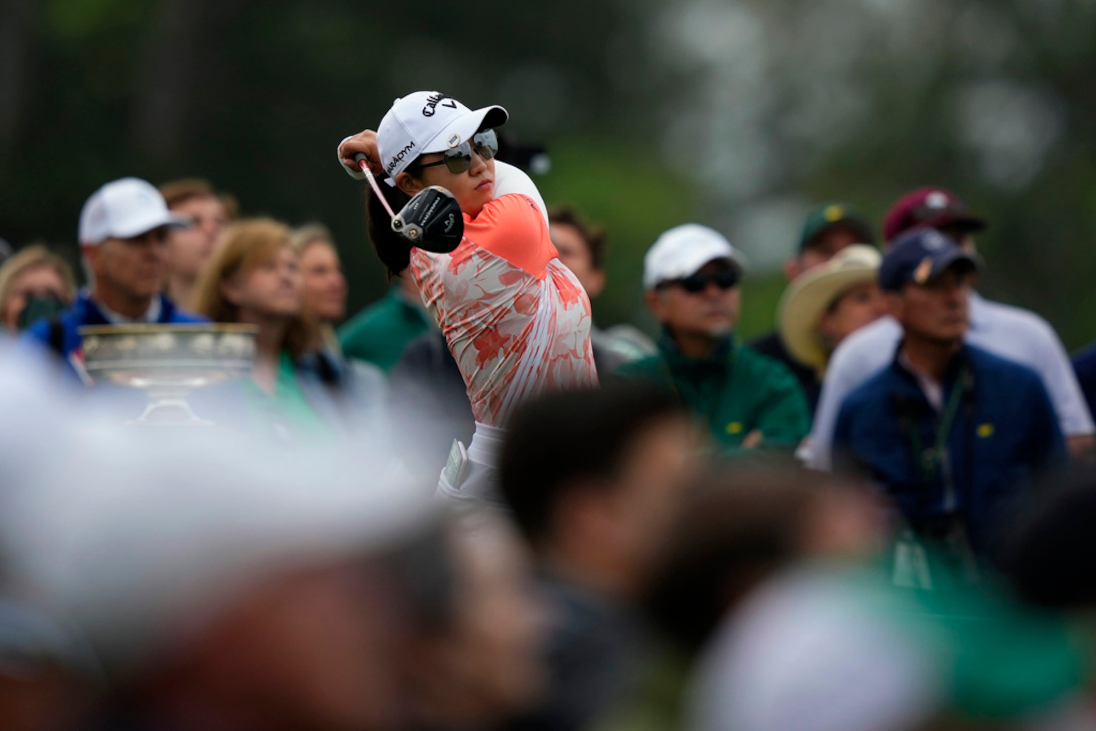 Rose Zhang watches her shot on the first tee during the final round of the Augusta National Women's Amateur golf tournament, Saturday, April 1, 2023, in Augusta, Ga. (AP Photo/Matt Slocum)