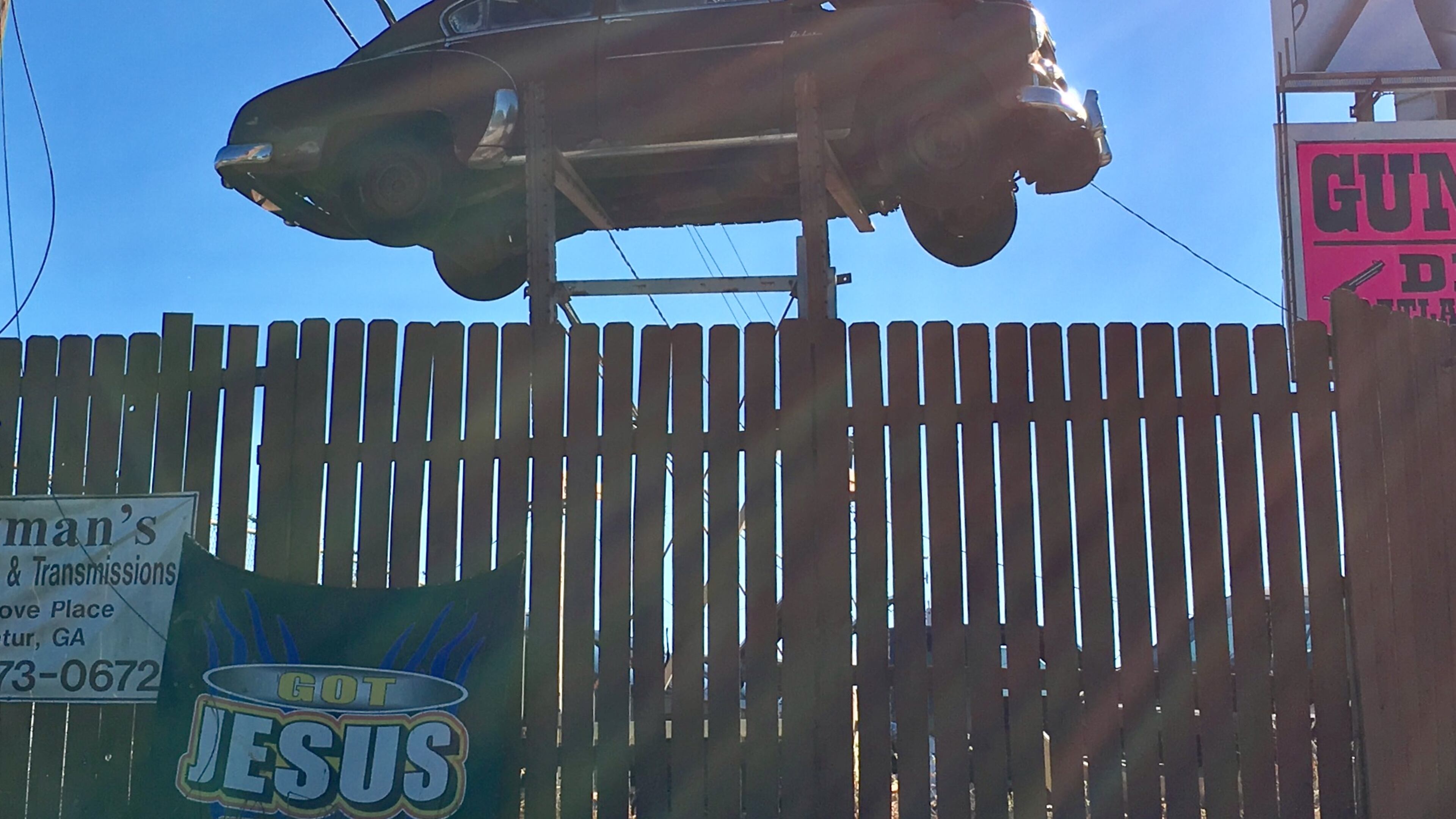 This iconic car-on-stilts lords over an East Decatur junkyard, but not for long. This is part of a 9.7-acre development that should begin construction next spring. Bill Banks file photo for the AJC