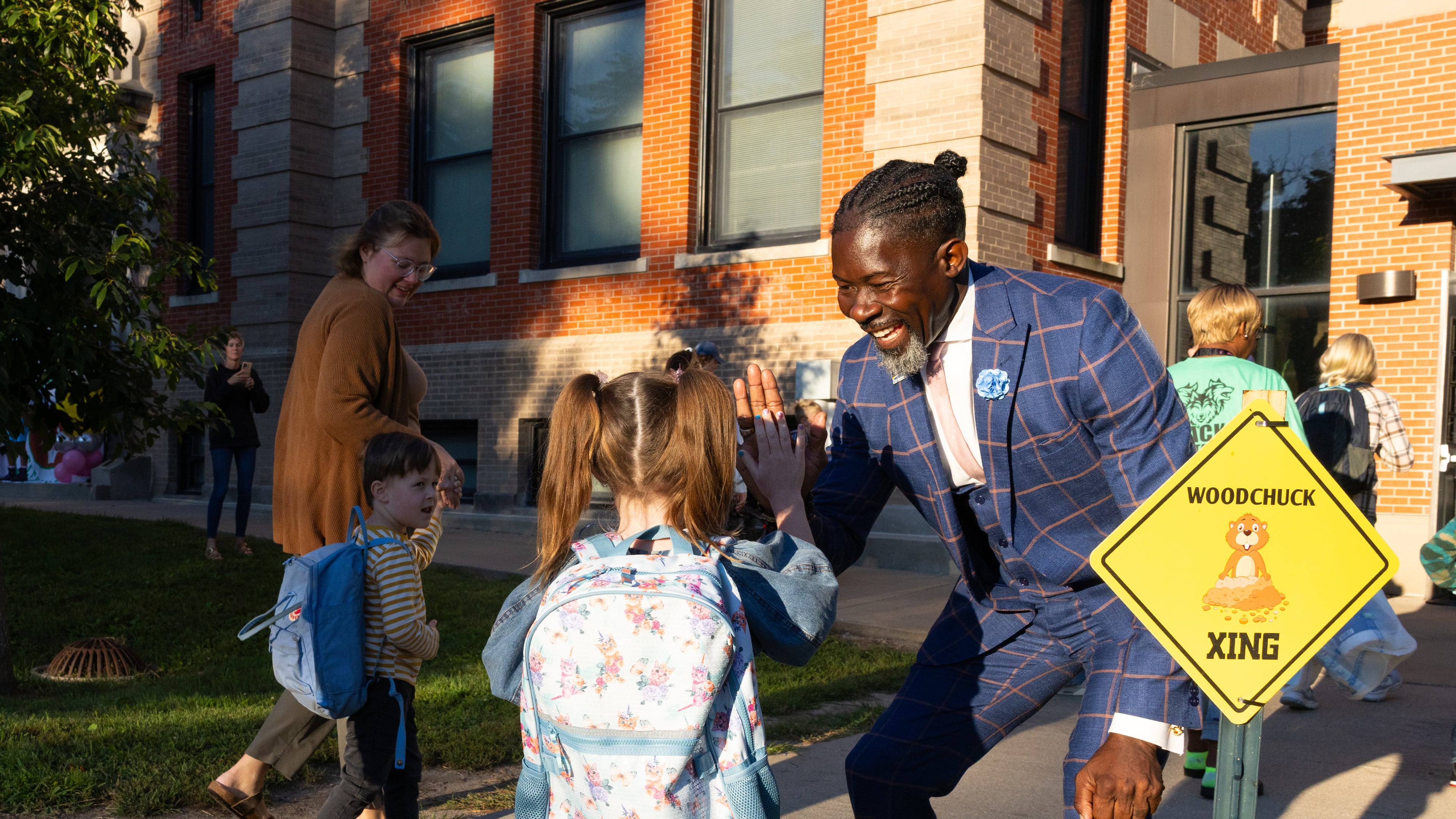 FILE - Ian Roberts, superintendent of Des Moines Public Schools, greets students at Greenwood Elementary School in Des Moines, Aug. 25, 2025. (Jon Lemons/Des Moines Public Schools via AP)