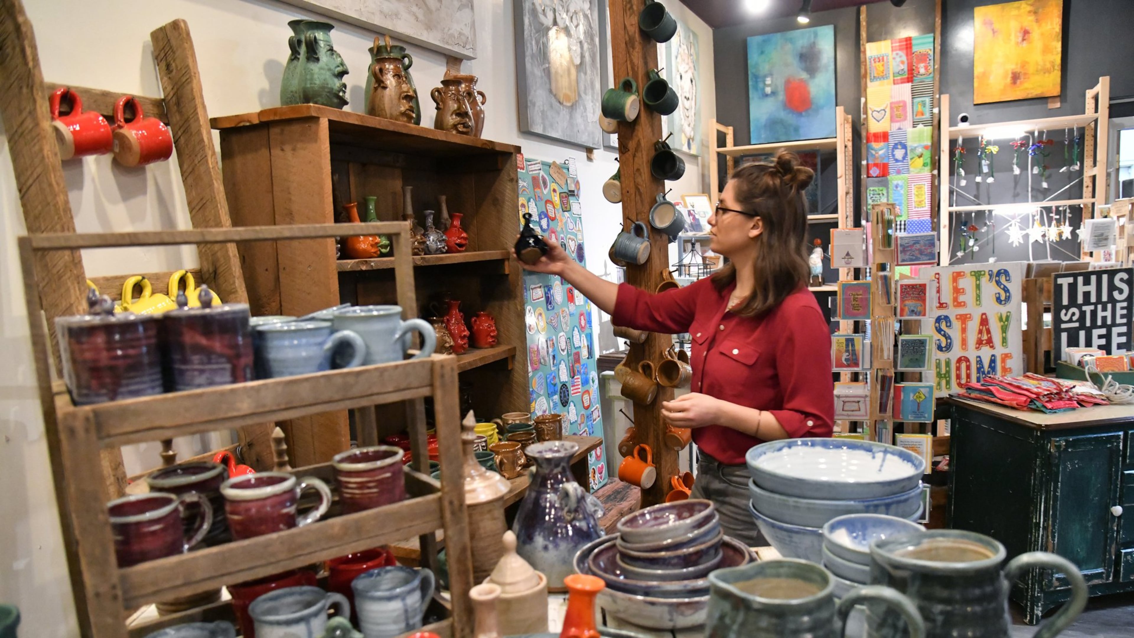 Jocelyn Lion places price tags at Wild Oats and Billy Goats in Decatur on Tuesday, February 18, 2020. (Hyosub Shin / Hyosub.Shin@ajc.com)