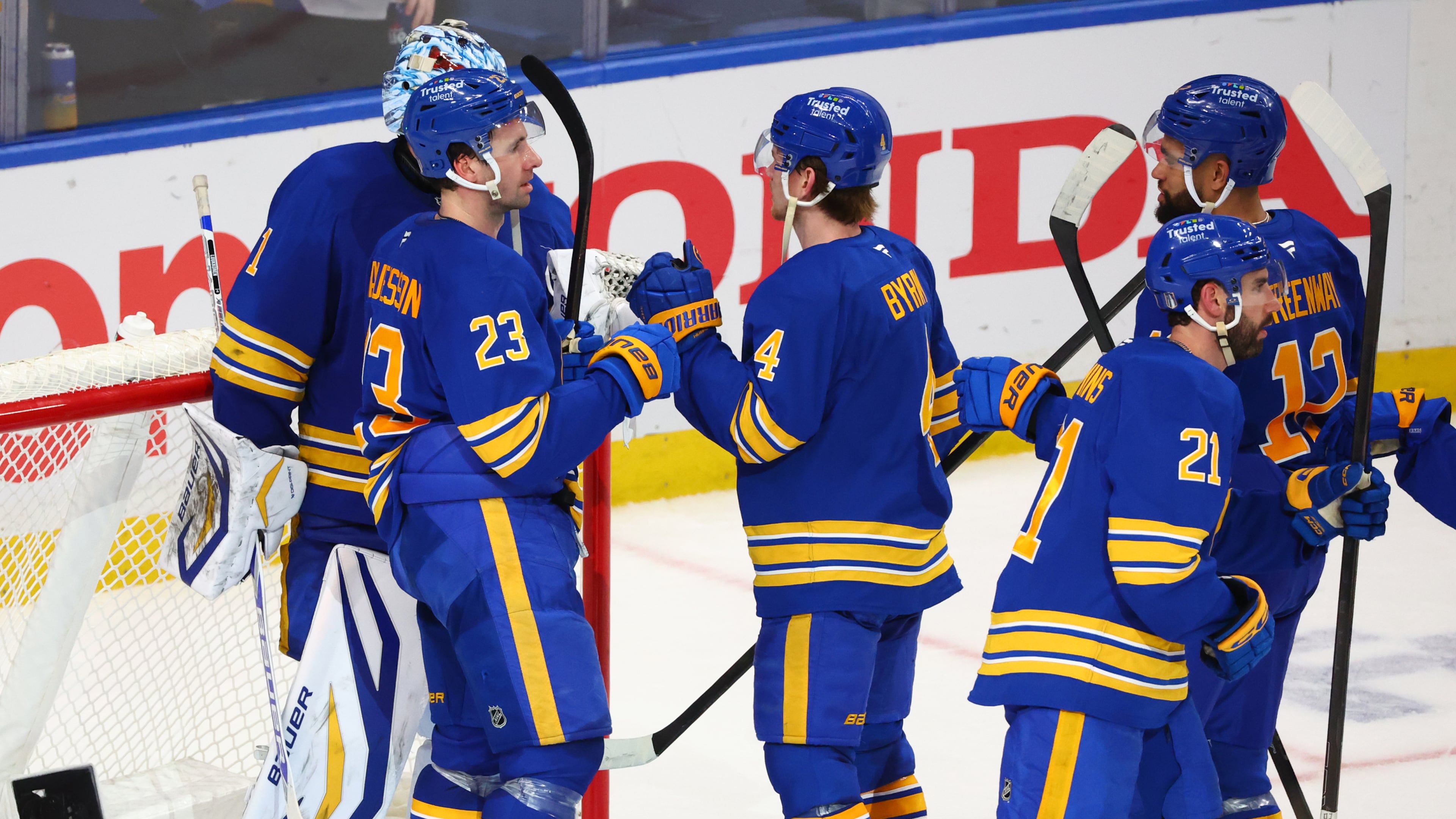 Buffalo Sabres players celebrate victory following the third period in Game 1 of a first-round NHL hockey Stanley Cup playoff series against the Boston Bruins, Sunday, April 19, 2026, in Buffalo, N.Y. (AP Photo/Jeffrey T. Barnes)