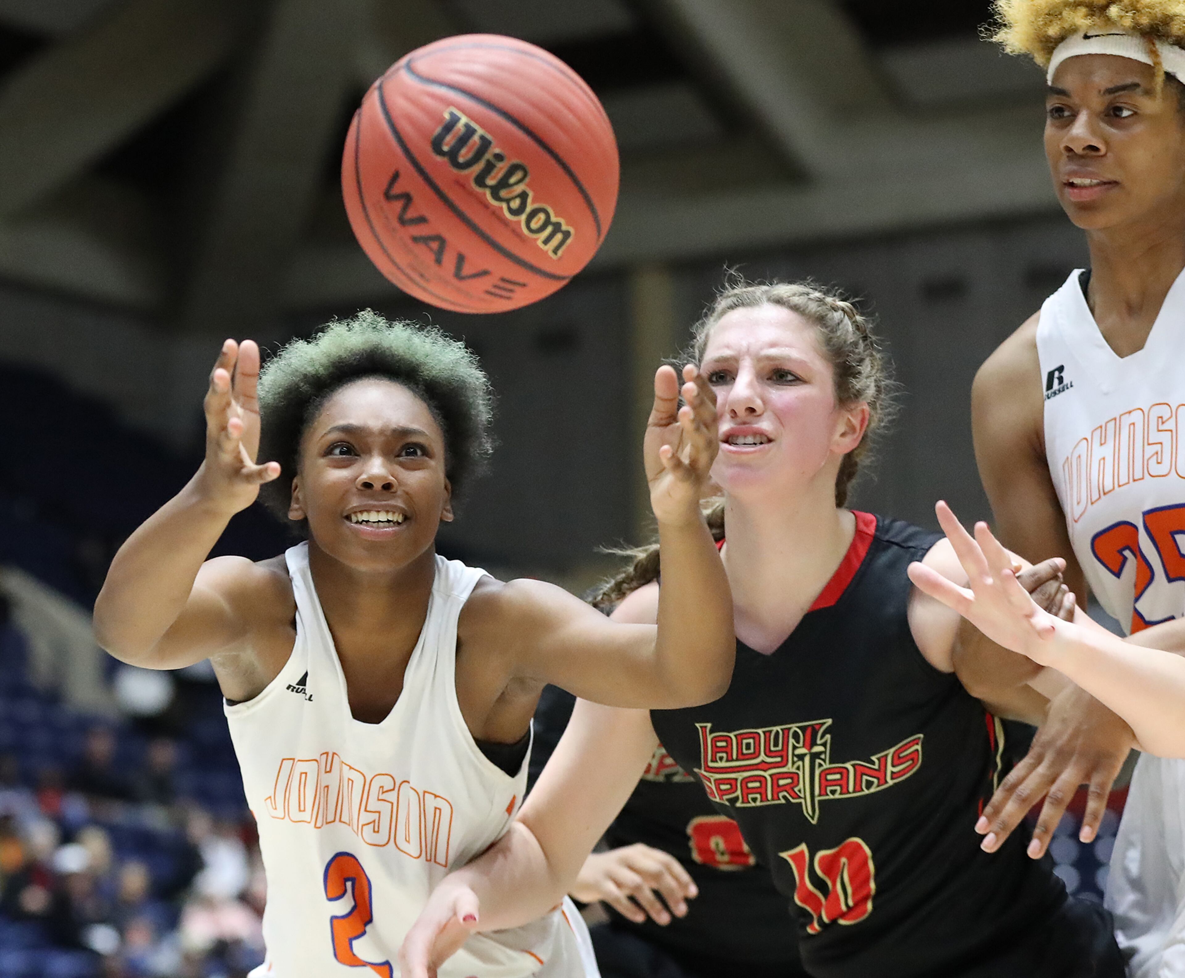March 8, 2018 Macon: GAC center MaryMartha Turner turns the ball over to Johnson-Savannah guard Alana Boone in their GHSA state basketball championship game on Thursday, March 8, 2018, in Macon. Curtis Compton/ccompton@ajc.com