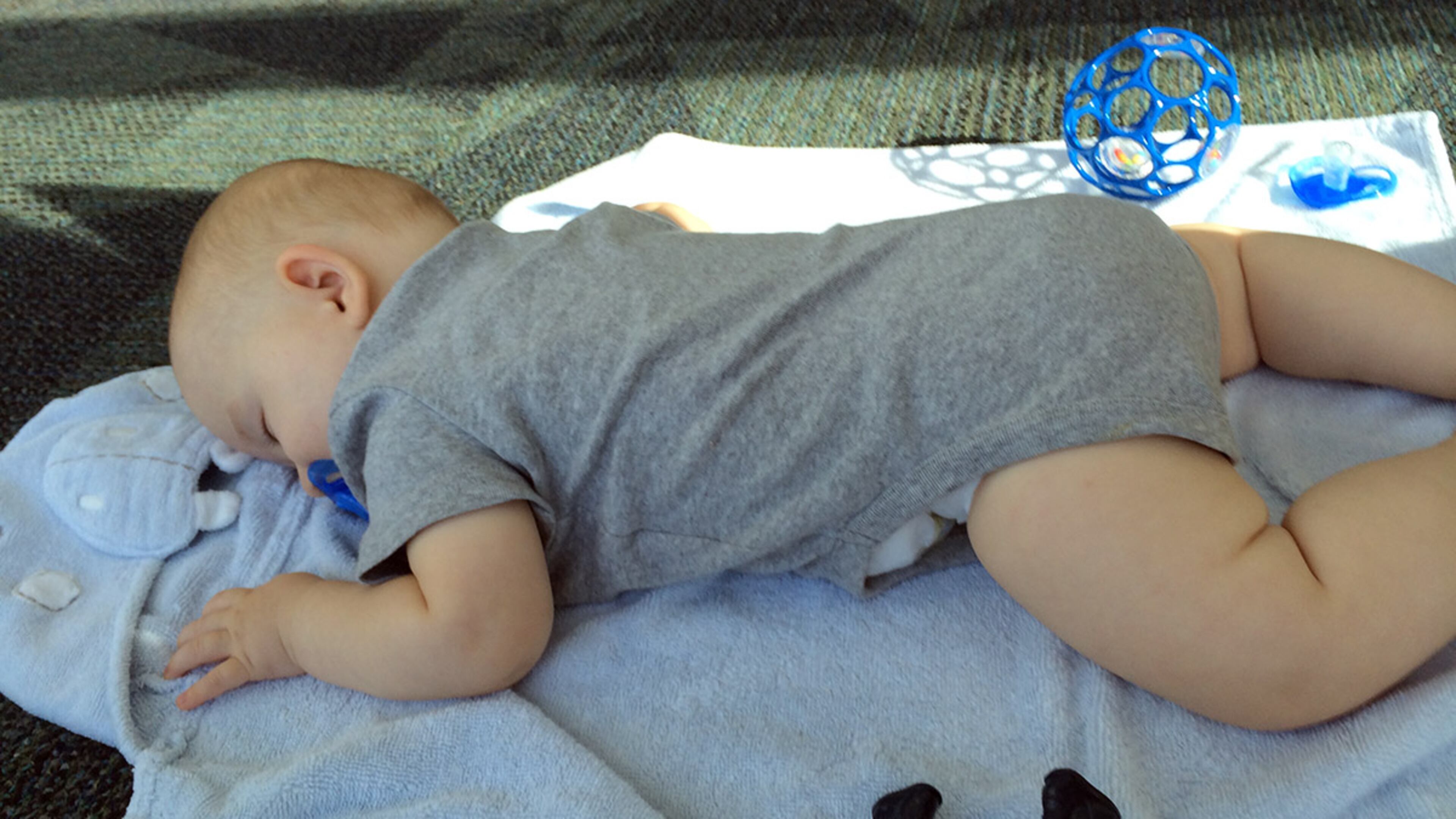 A six-hour flight delay proved too much for this youngster, who stretched out on the floor of Hartsfield-Jackson International Airport for a snooze. "Expect the unexpected," his mom said. Photo courtesy of Anna McIldoon