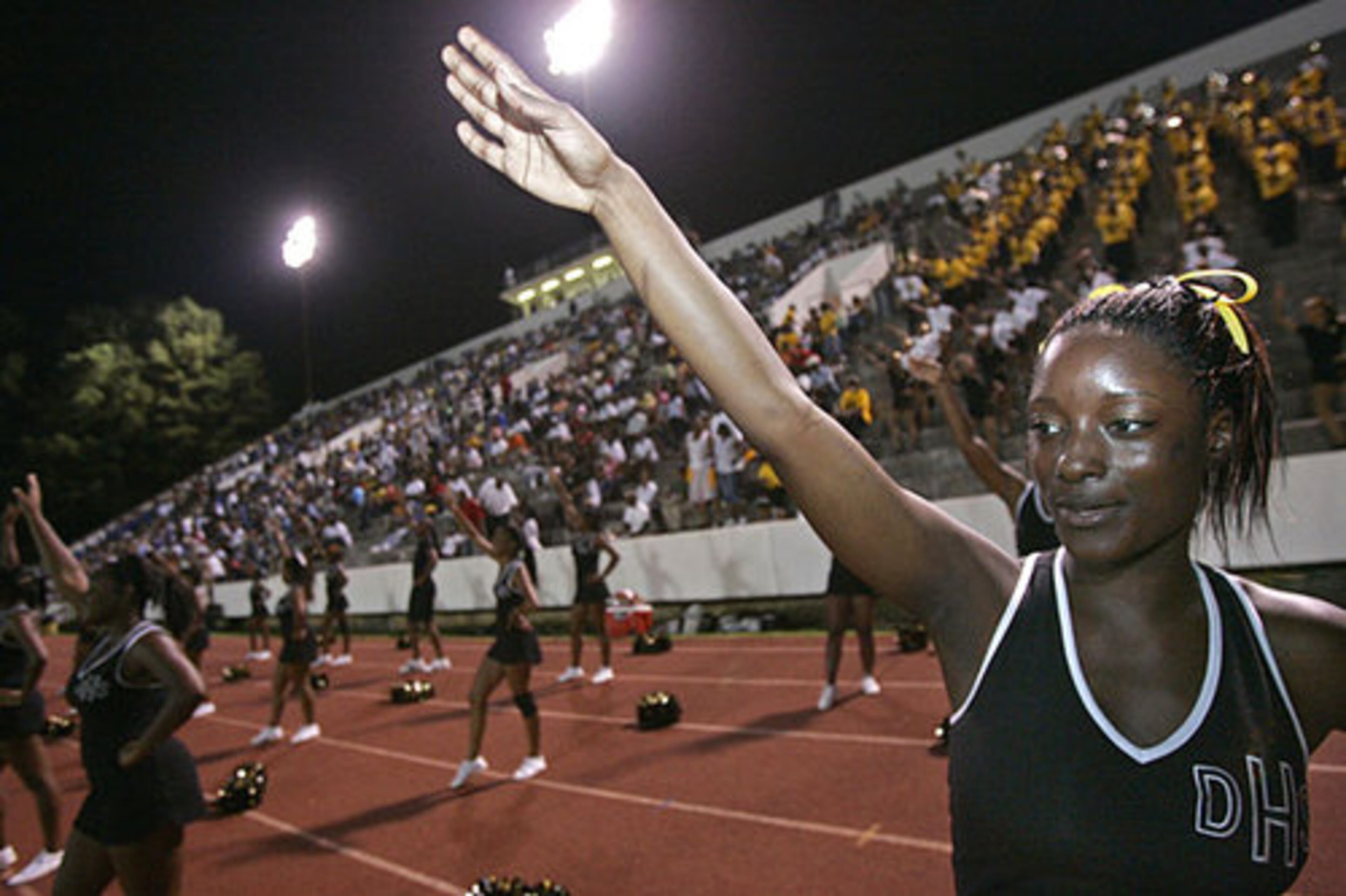 Douglass 11th-grade cheerleader Ashley Wilson tries to fire up the Astros.