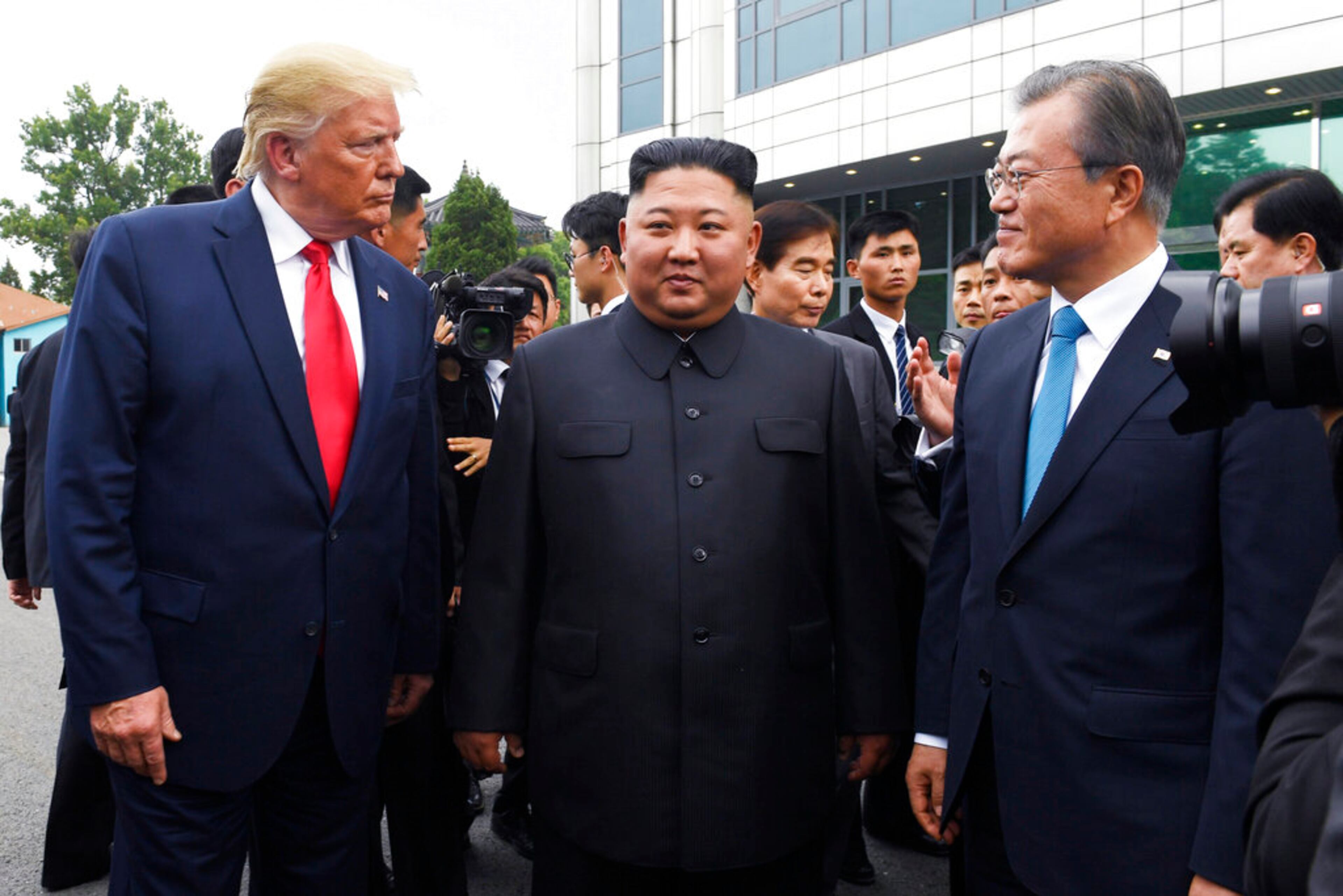 FILE - In this June 30, 2019, file photo, President Donald Trump, left, meets with North Korean leader Kim Jong Un and South Korean President Moon Jae-in, right, at the border village of Panmunjom in the Demilitarized Zone, South Korea. North Korea on Saturday, June 13, 2020 again bashed South Korea, telling its rival to stop ânonsensicalâ talk about its denuclearization and vowing to expand its military capabilities. (AP Photo/Susan Walsh)