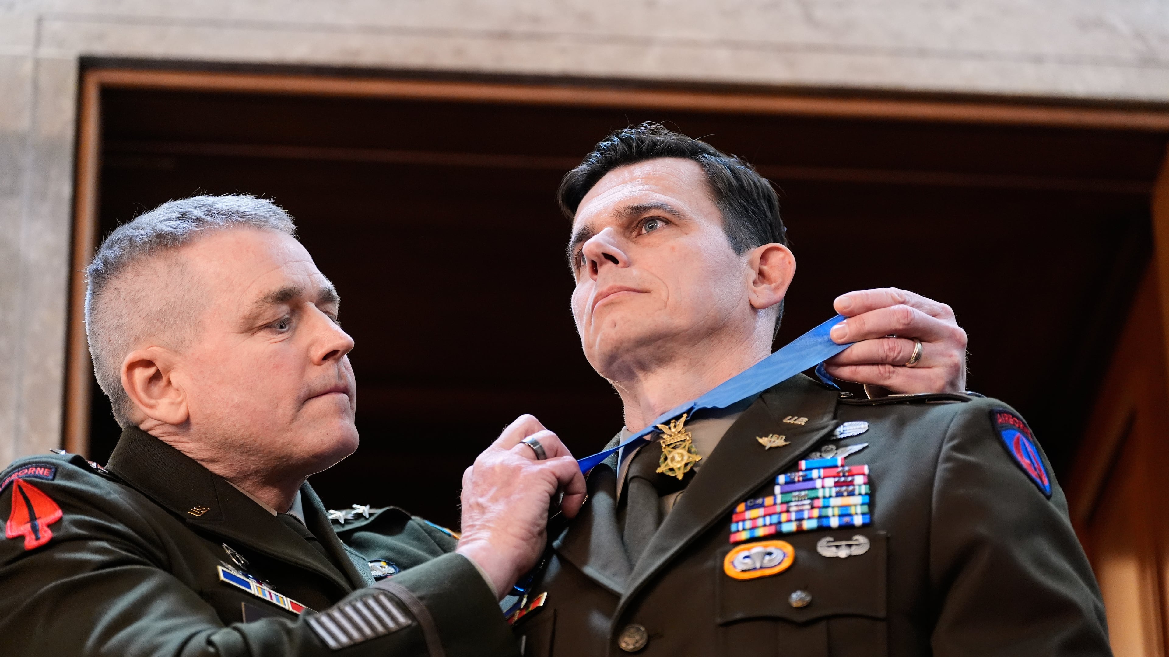 U.S. Army Chief Warrant Officer Eric Slover receives a Medal of Honor during President Donald Trump's State of the Union address to a joint session of Congress in the House chamber at the U.S. Capitol in Washington, Tuesday, Feb. 24, 2026. (AP Photo/Alex Brandon)