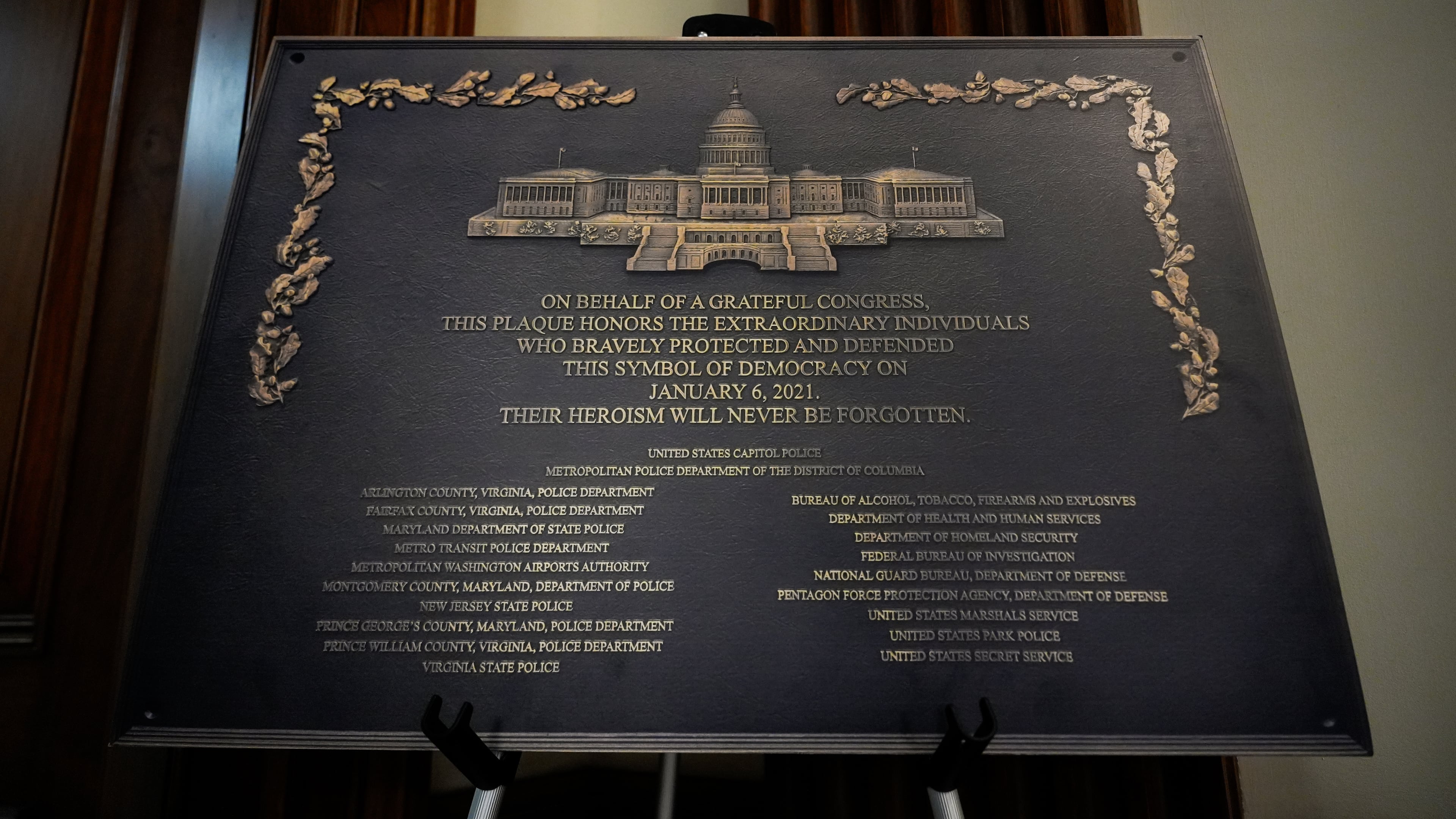 A replica plaque commemorating the Jan. 6, 2021 Capitol riot stands outside the office of House Minority Leader Hakeem Jeffries, D-N.Y, Tuesday, Dec. 30, 2025, at the U.S. Capitol in Washington. (AP Photo/Julia Demaree Nikhinson)