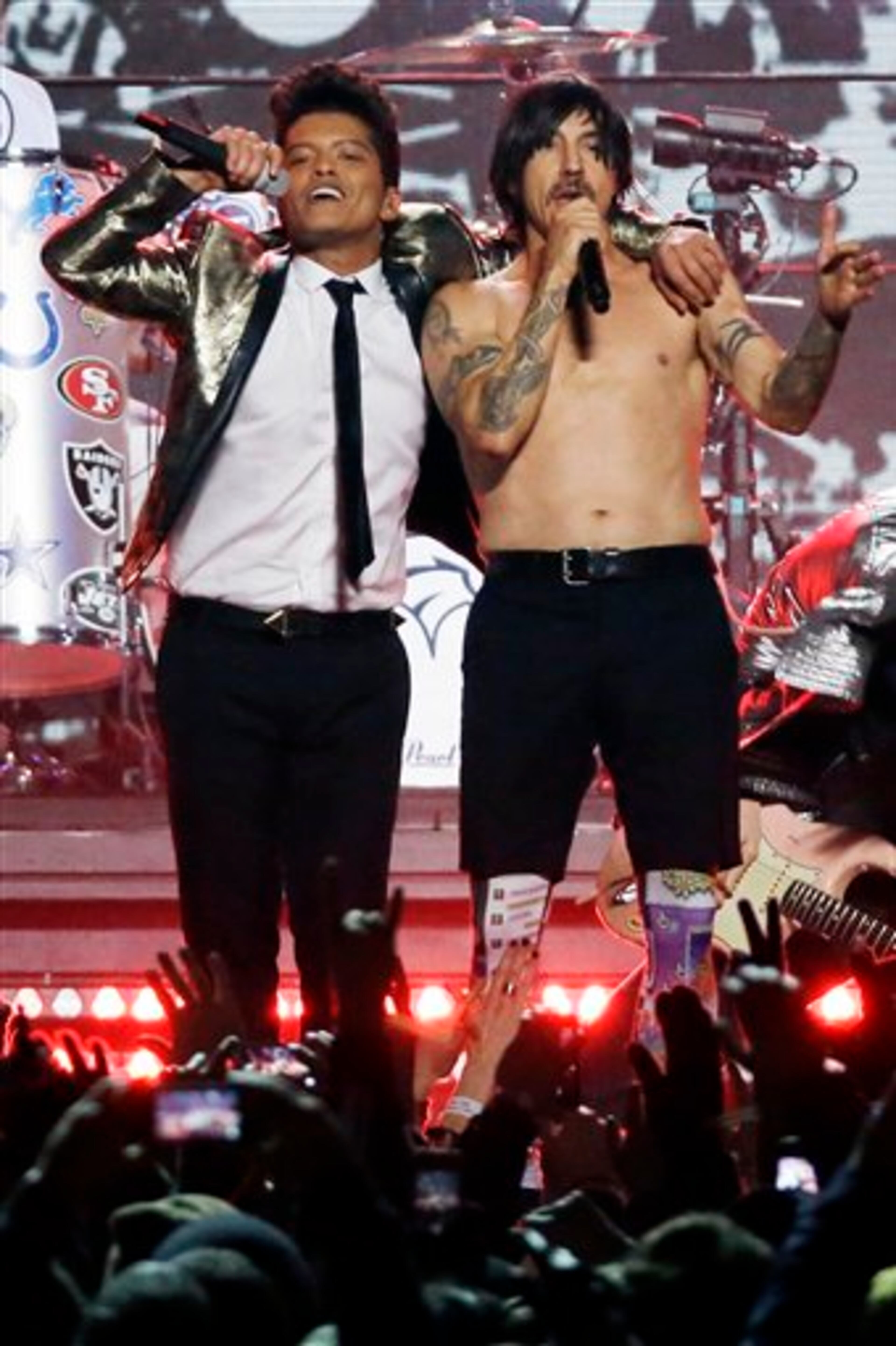 Bruno Mars, left, and Anthony Kiedis of the The Red Hot Chili Peppers perform during the halftime show of the NFL Super Bowl XLVIII football game Sunday, Feb. 2, 2014, in East Rutherford, N.J. (AP Photo/Mark Humphrey)