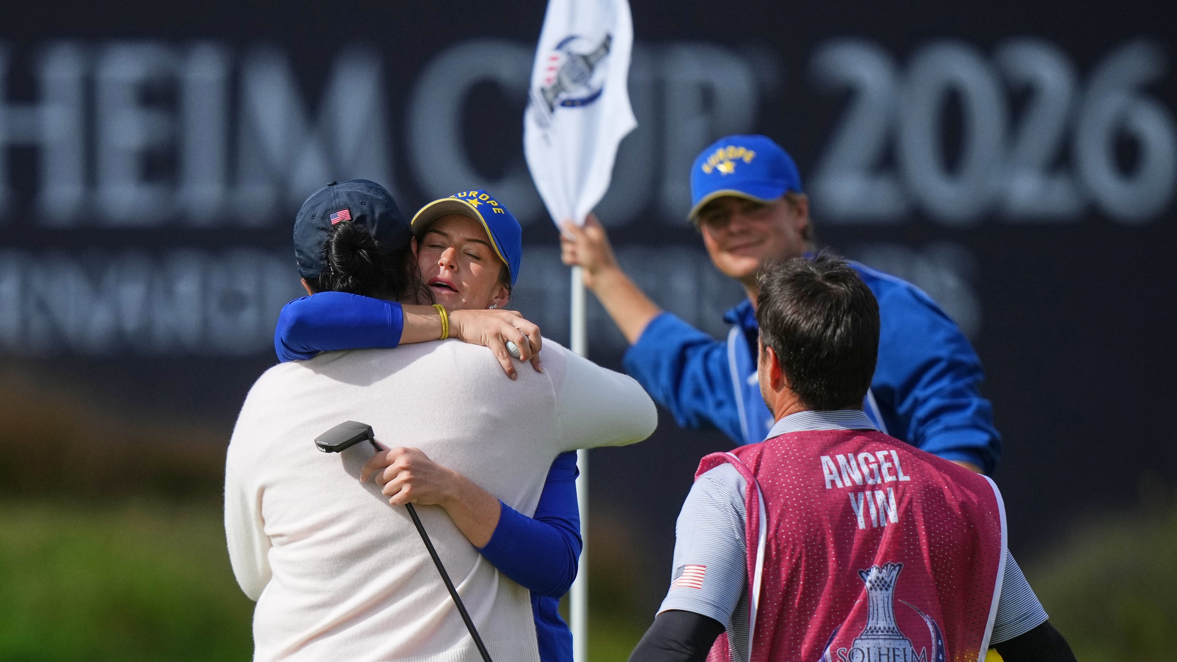 Linn Grant of Europe embraces Angel Yin of the United States after winning their singles match during the final day of the Solheim Cup in Den Bosch, Netherlands, Sunday, Sept. 13, 2026. (AP Photo/Alastair Grant)