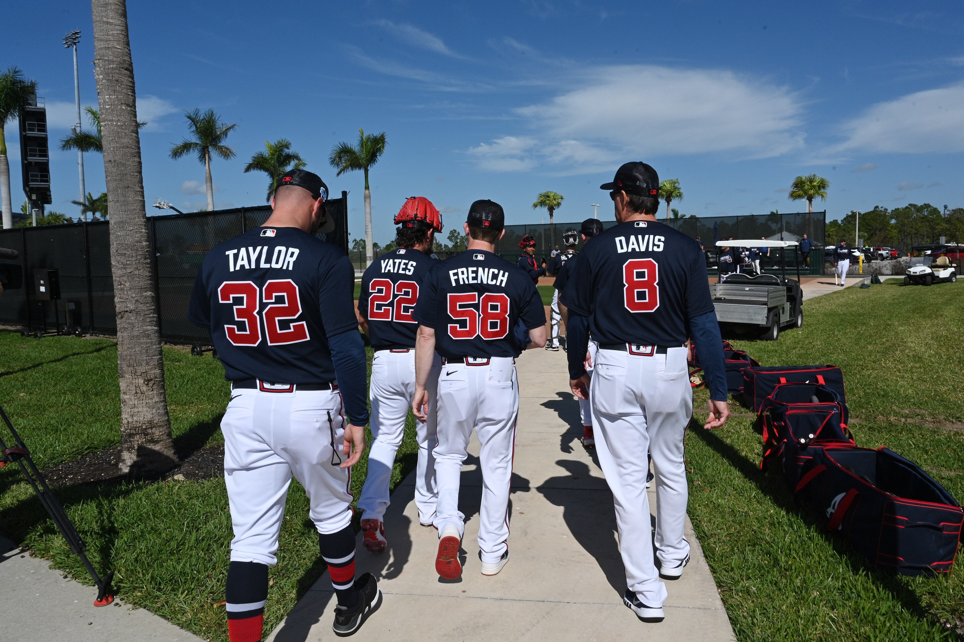 Braves players walk to their workout during spring training Thursday at CoolToday Park in North Port, Florida. (Hyosub Shin / Hyosub.Shin@ajc.com)