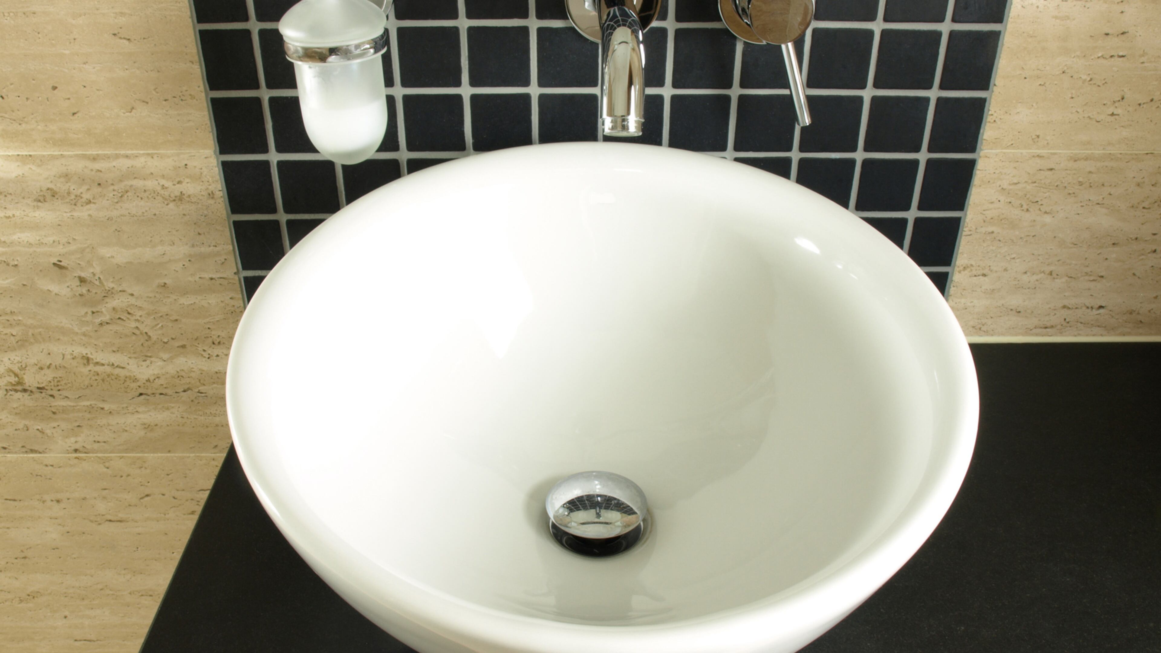 With a beautiful stone vessel sink, the sink itself can be the design centerpiece for the room. (Dreamstime)