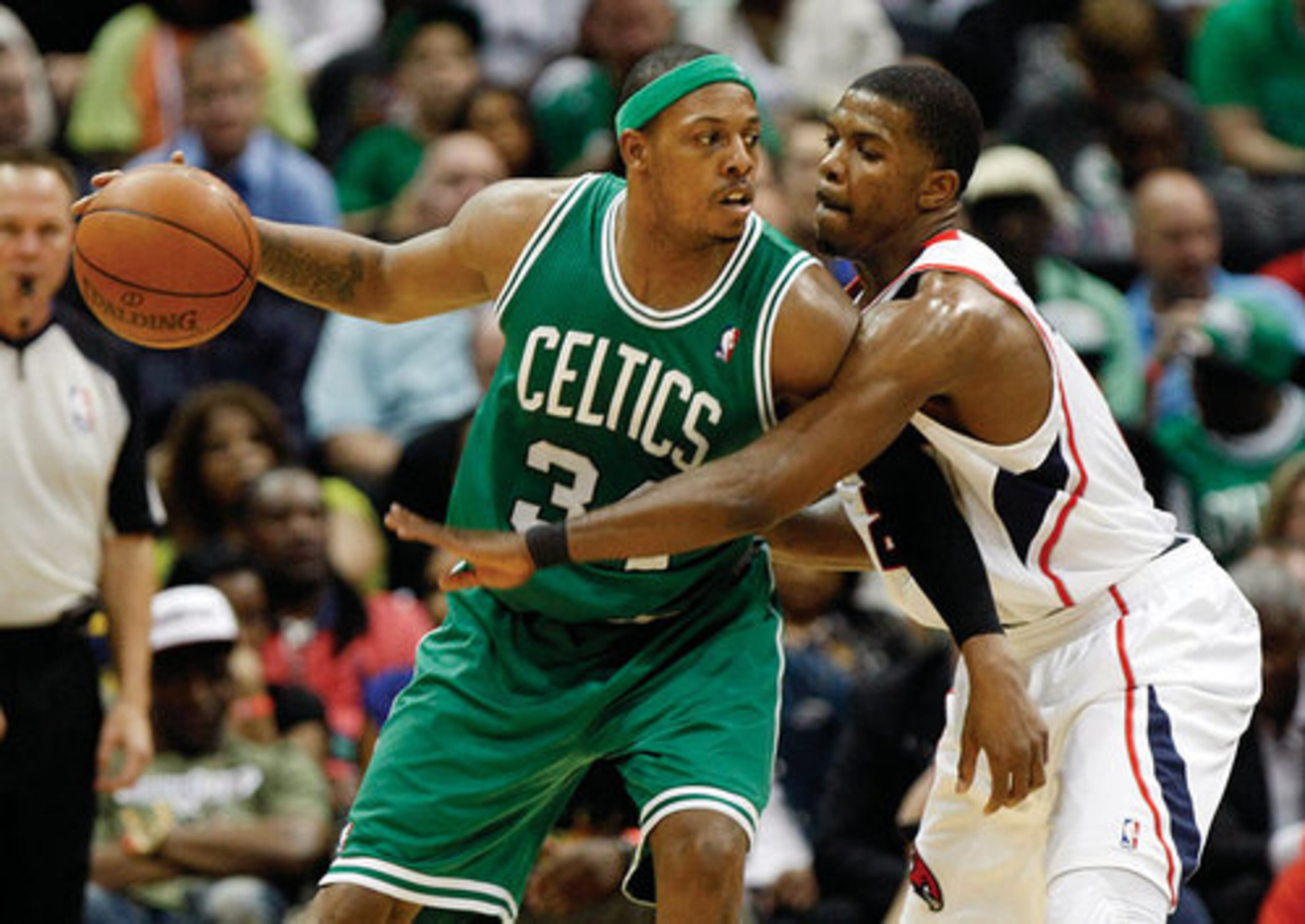 Joe Johnson defends against Boston Celtics Paul Pierce during the first half of their game at Philips Arena, Monday, March 19, 2012. The Celtics won 79-76.