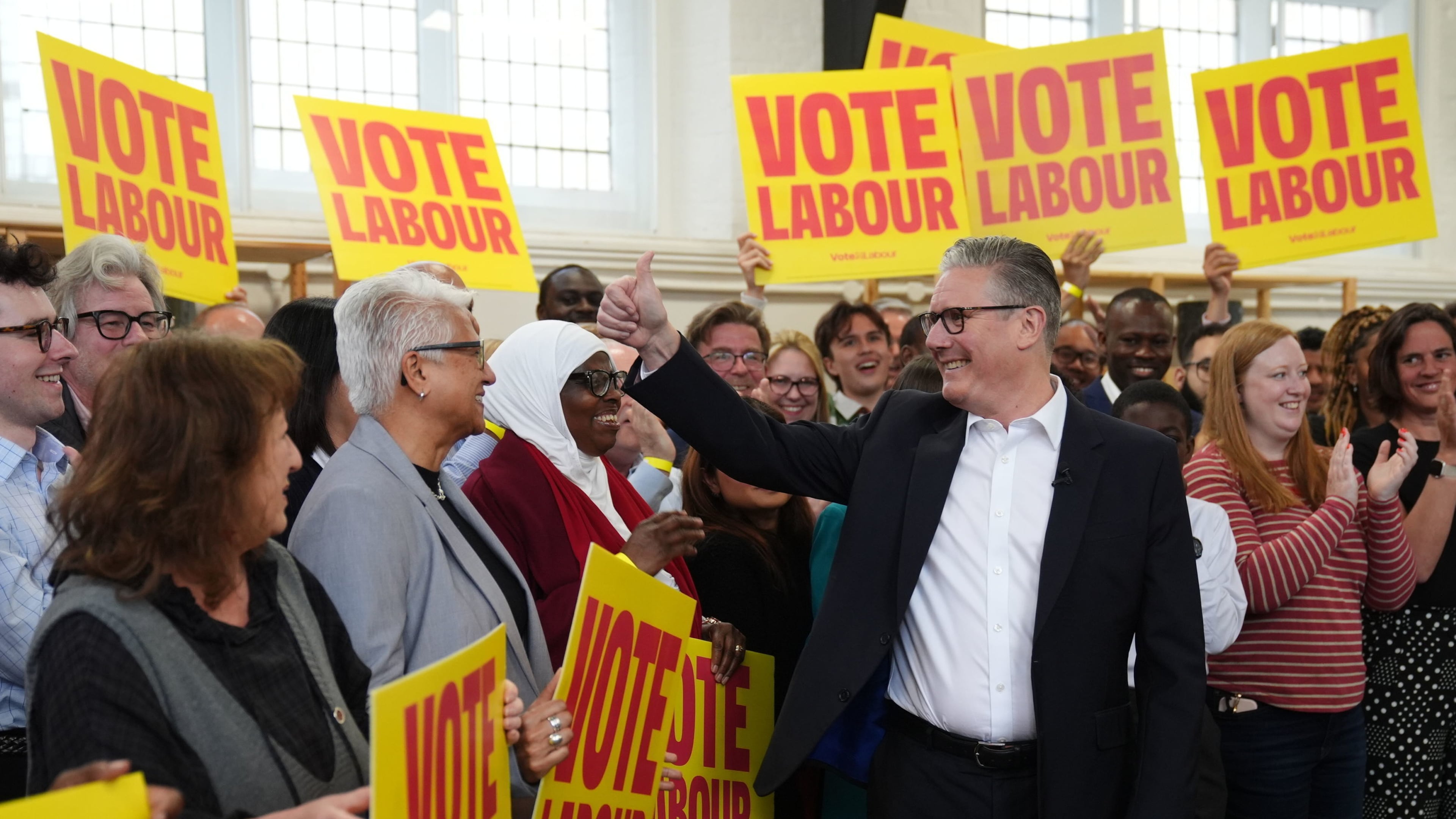 Britain's Prime Minister Keir Starmer gestures to supporters during a visit to All Saints Hall in south London, Tuesday May 5, 2026, whilst campaigning for the upcoming local elections. (Ben Whitley/PA via AP)
