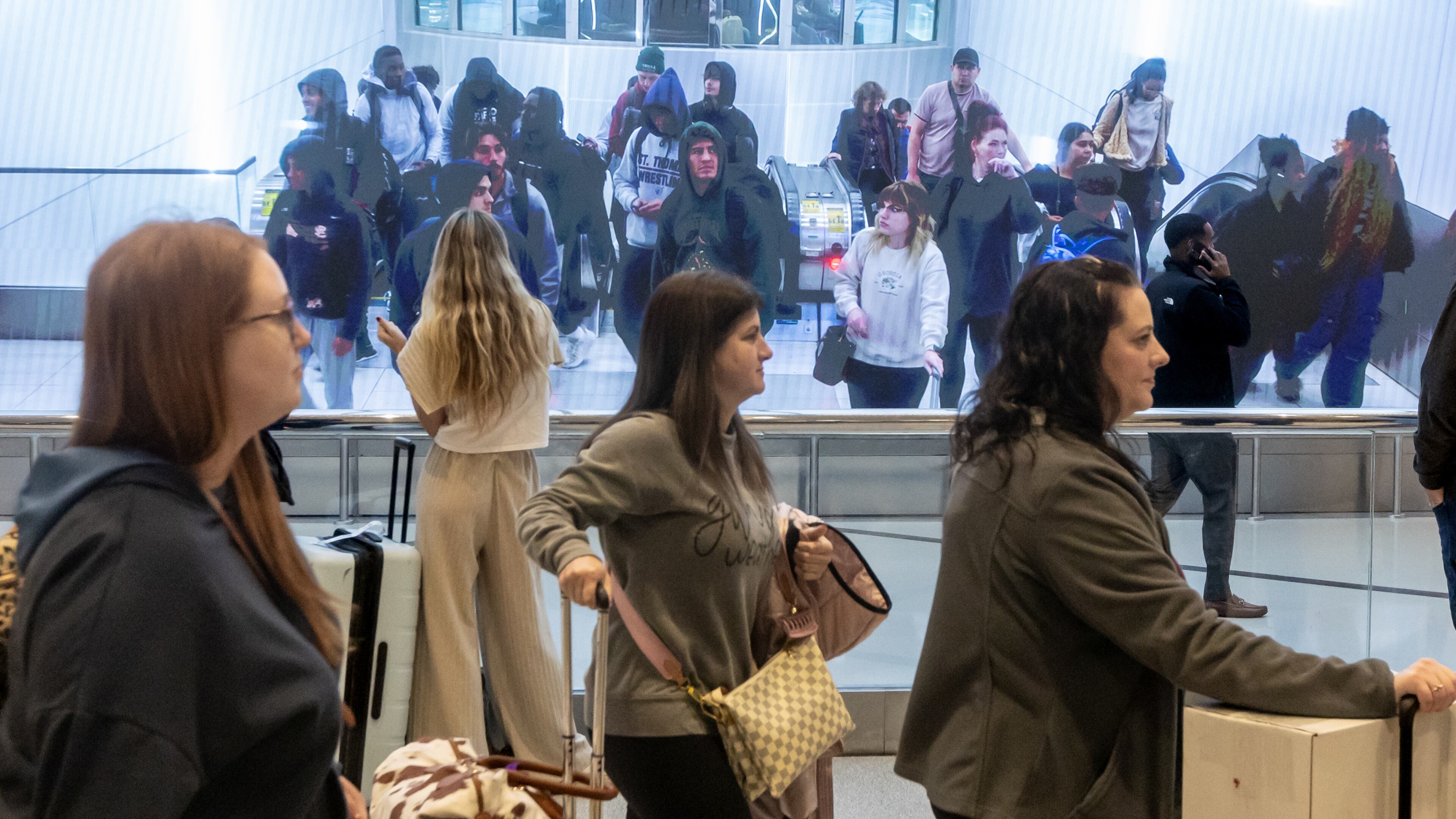 Passengers make their way through Hartfield-Jackson International Airport in Atlanta on Friday, Nov. 22, 2024. Nationally, AAA predicts a record 119.3 million people will leave home between Dec. 21 and New Year’s Day. (John Spink/AJC)