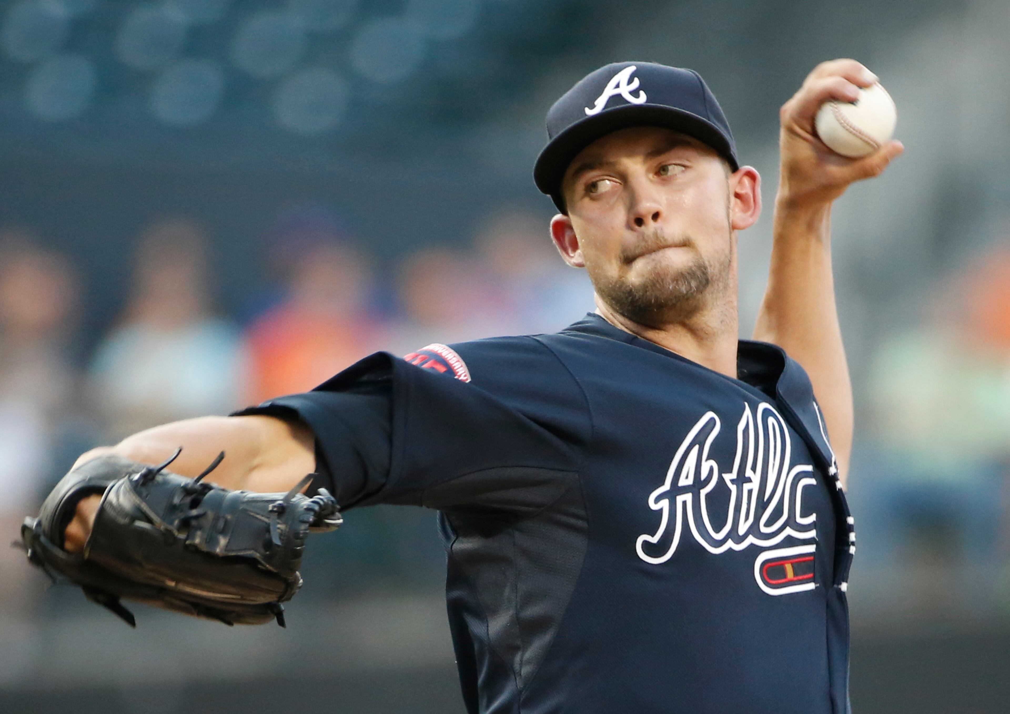 Atlanta Braves starting pitcher Mike Minor delivers in the first inning of a baseball game against the New York Mets in New York, Monday, July 7, 2014. (AP Photo/Kathy Willens)