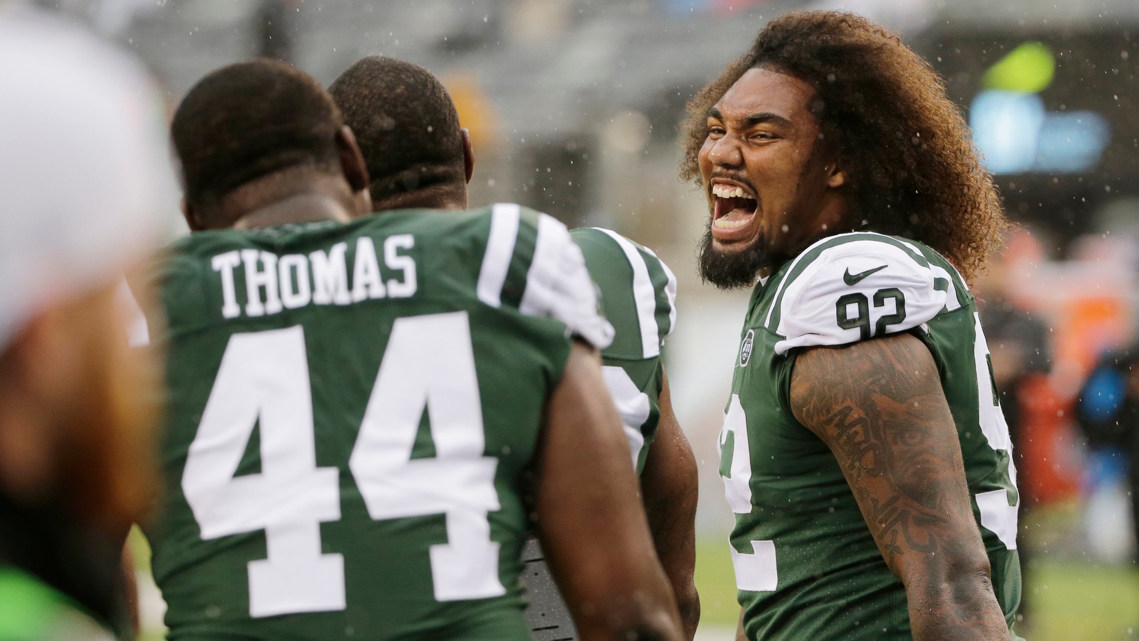 New York Jets defensive end Leonard Williams (92) laughs with teammate Lawrence Thomas (44) before an NFL football game against the Atlanta Falcons Sunday, Oct. 29, 2017, in East Rutherford, N.J. (AP Photo/Seth Wenig)