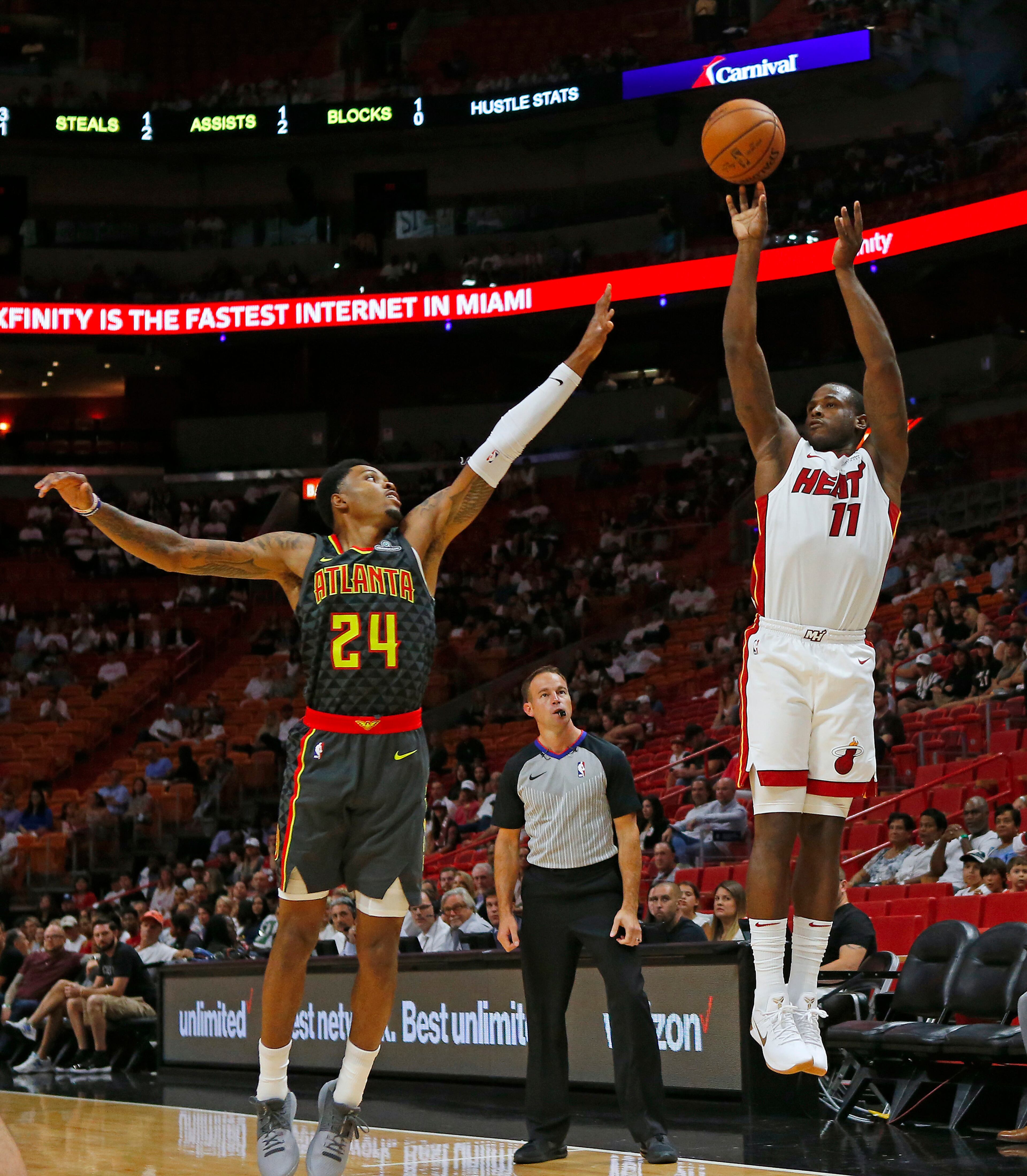 Miami Heat guard Dion Waiters shoots over Atlanta Hawks forward Kent Bazemore (24) during the first quarter of an NBA preseason basketball game on Sunday, Oct. 1, 2017 at the AmericanAirlines Arena in Miami, Fla. (David Santiago/Miami Herald/TNS)