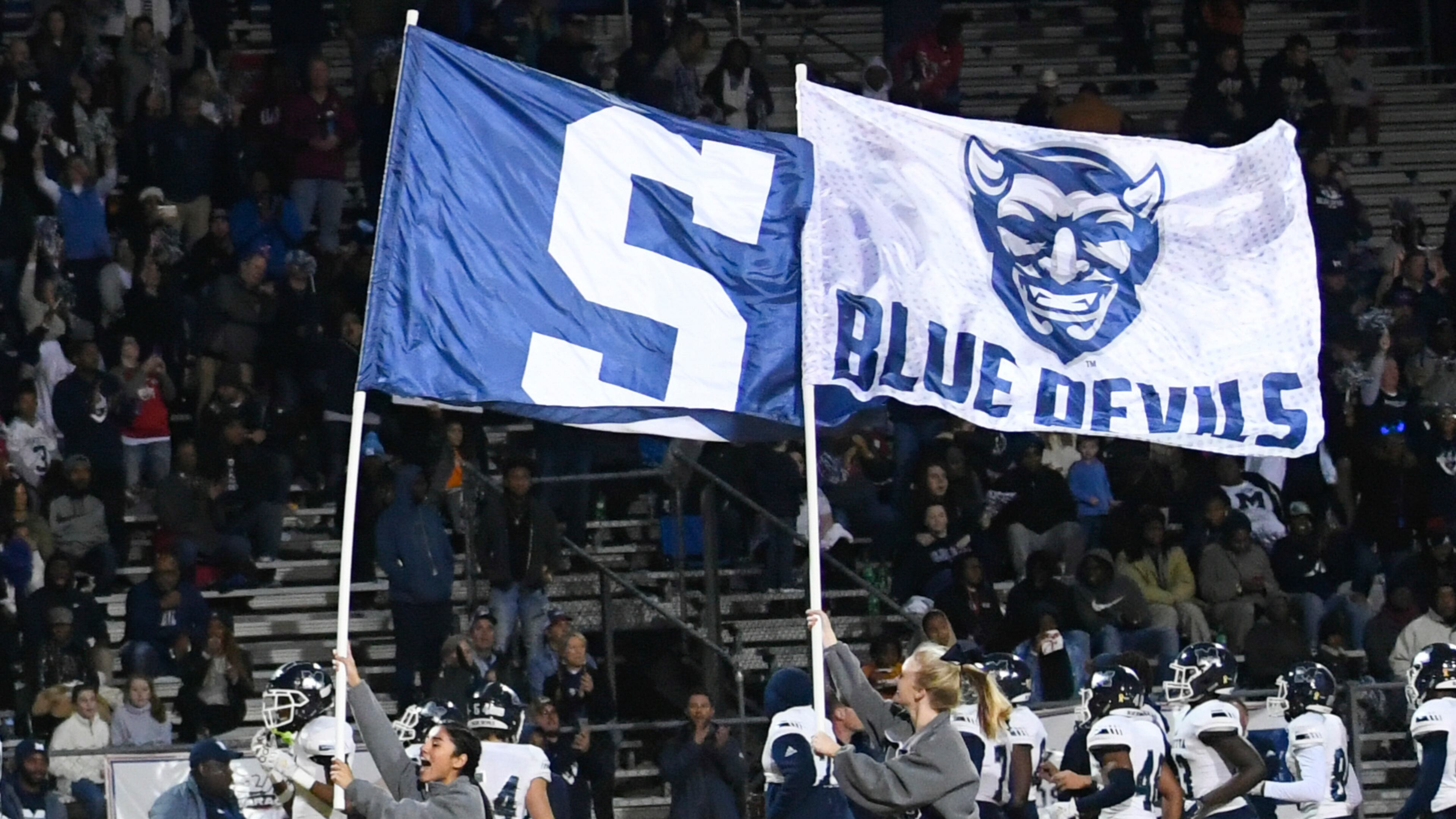 Marietta cheerleaders lead their team on to the field to take on Parkview during a high school semifinal playoff football game Friday, Dec. 6, 2019, in Lilburn. The Blue Devilos will play in the state champioship game Saturday. Photo by John Amis / Special