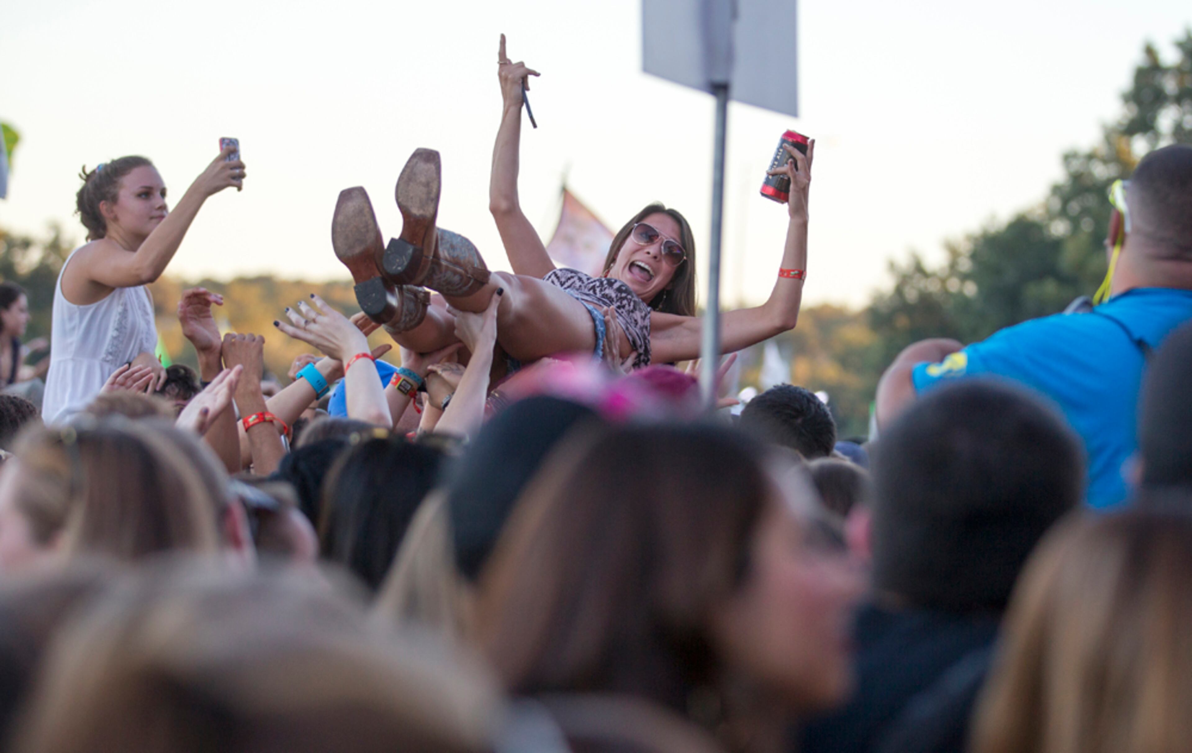 An ACL fan crowd surfs as Chidish Gambino performs at the Honda stage on Friday, Oct. 3, 2014.
