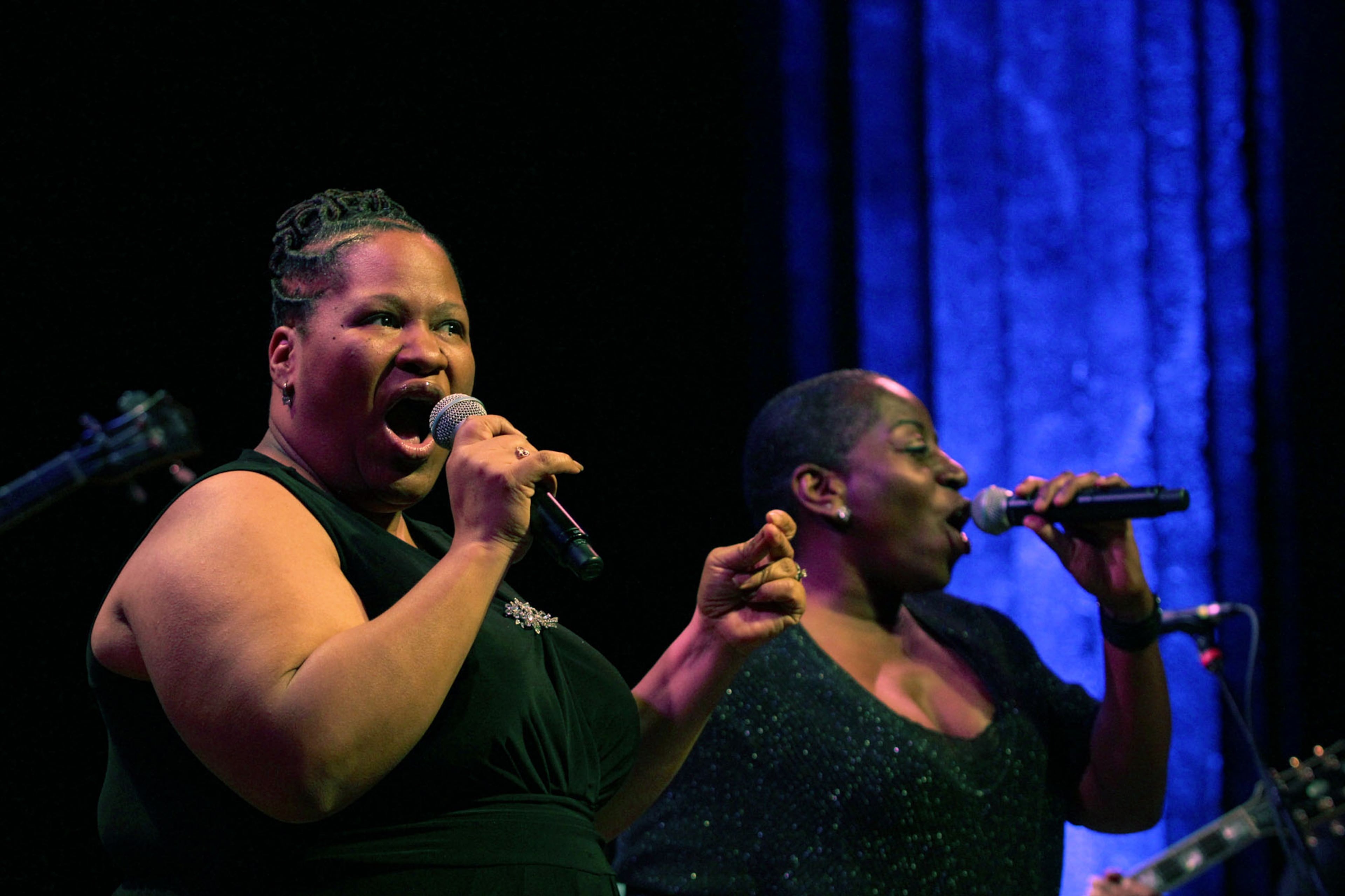Dap Kings Dapettes Starr Duncan, left and Saundra Williams warm up the audience with a couple of their own songs before Sharon Jones take stye stage.