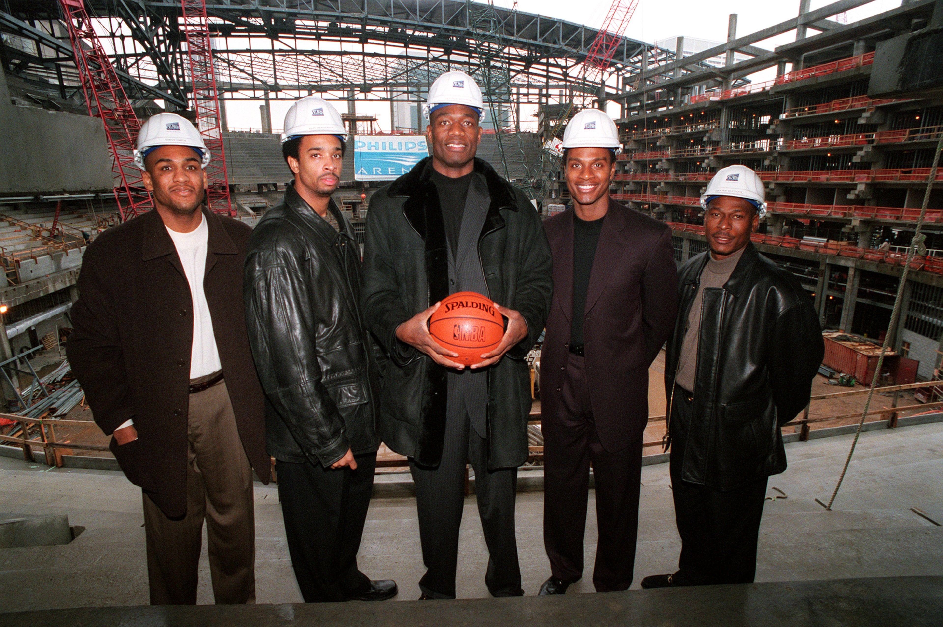 The starting lineup of the Atlanta Hawks stand in the newly named Philips Arena with their construction hats and pose for the abbreviated season. From left to right are Steve Smith, Alan Henderson, Diekembe Mutombo, Alfonzo Ellis and Mookie Blaylock. STAFF PHOTO BY W.A. BRIDGES JR.