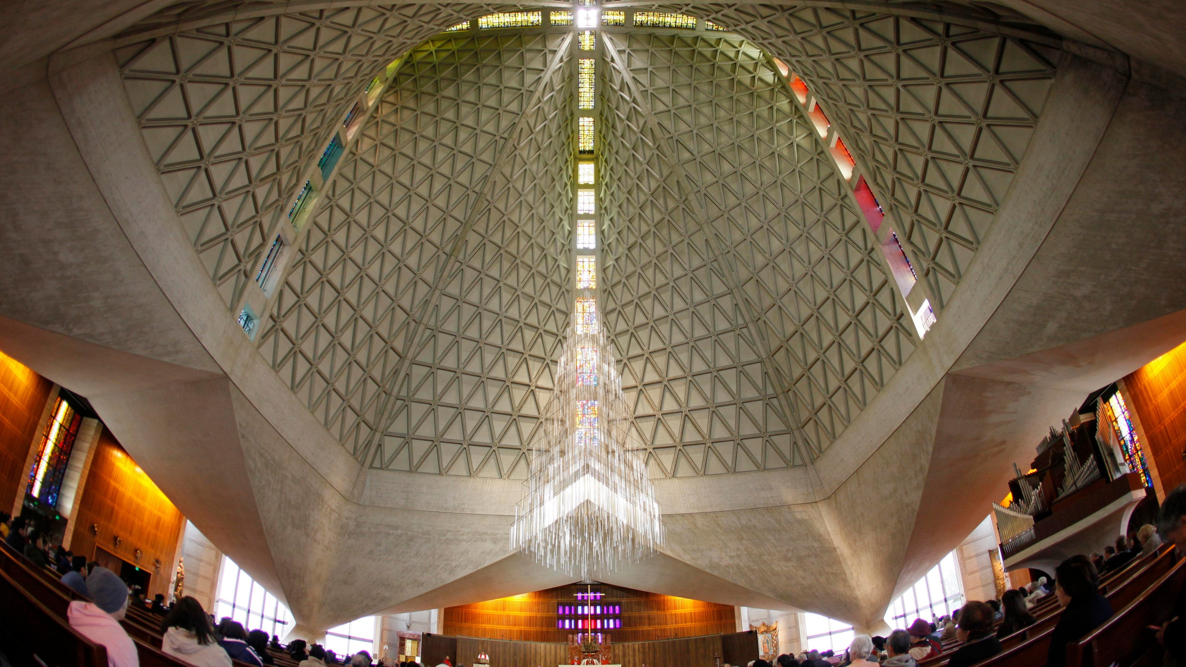 FILE - Parishioners attend a service at St. Mary's Cathedral, the mother church of the archdiocese in San Francisco, on April 2, 2010. (AP Photo/Eric Risberg, File)