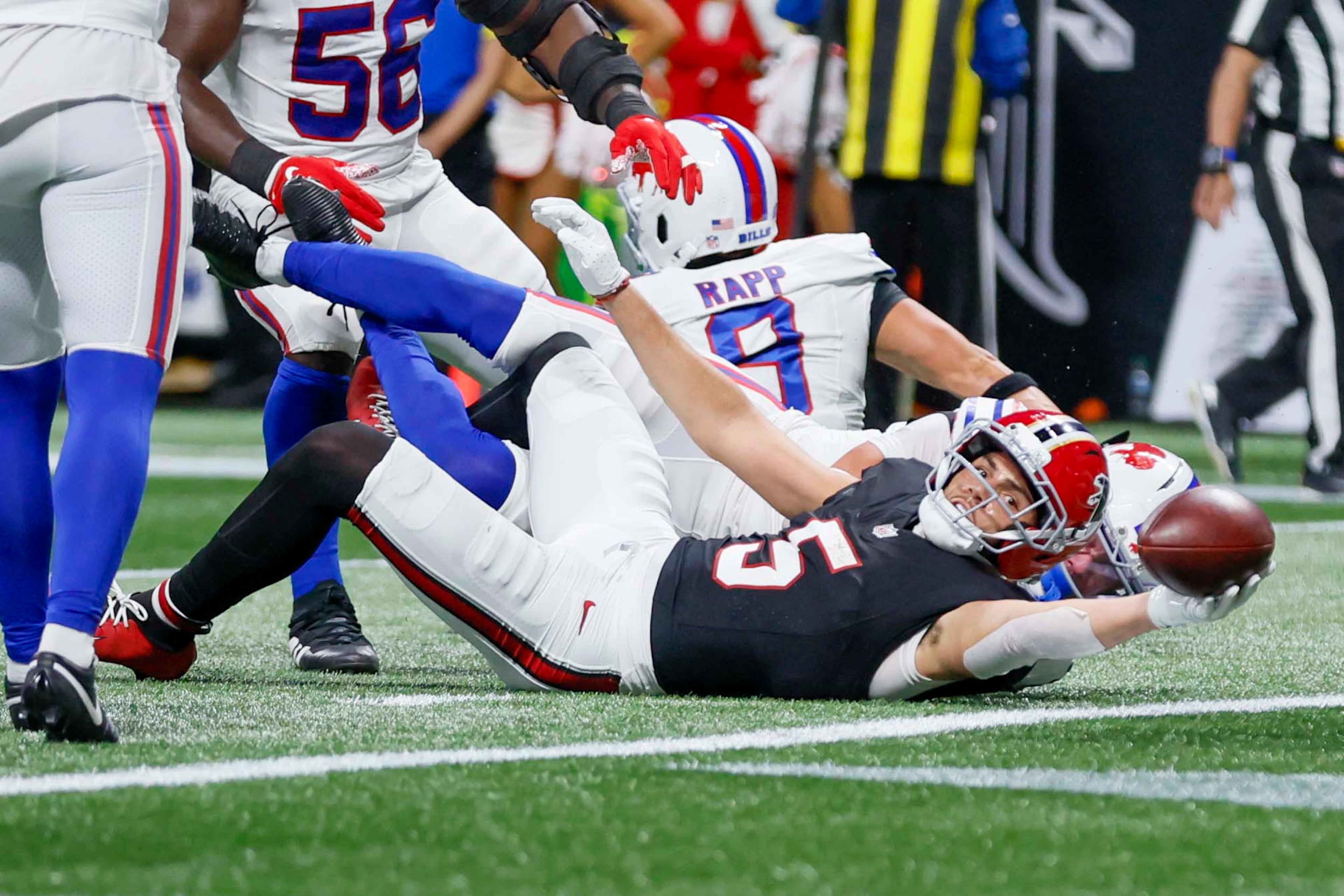 Atlanta Falcons wide receiver Drake London (right) scores a touchdown during the first half of an NFL game against the Buffalo Bills at Mercedes-Benz Stadium in Atlanta on Monday, October 13, 2025. (Miguel Martinez/AJC)