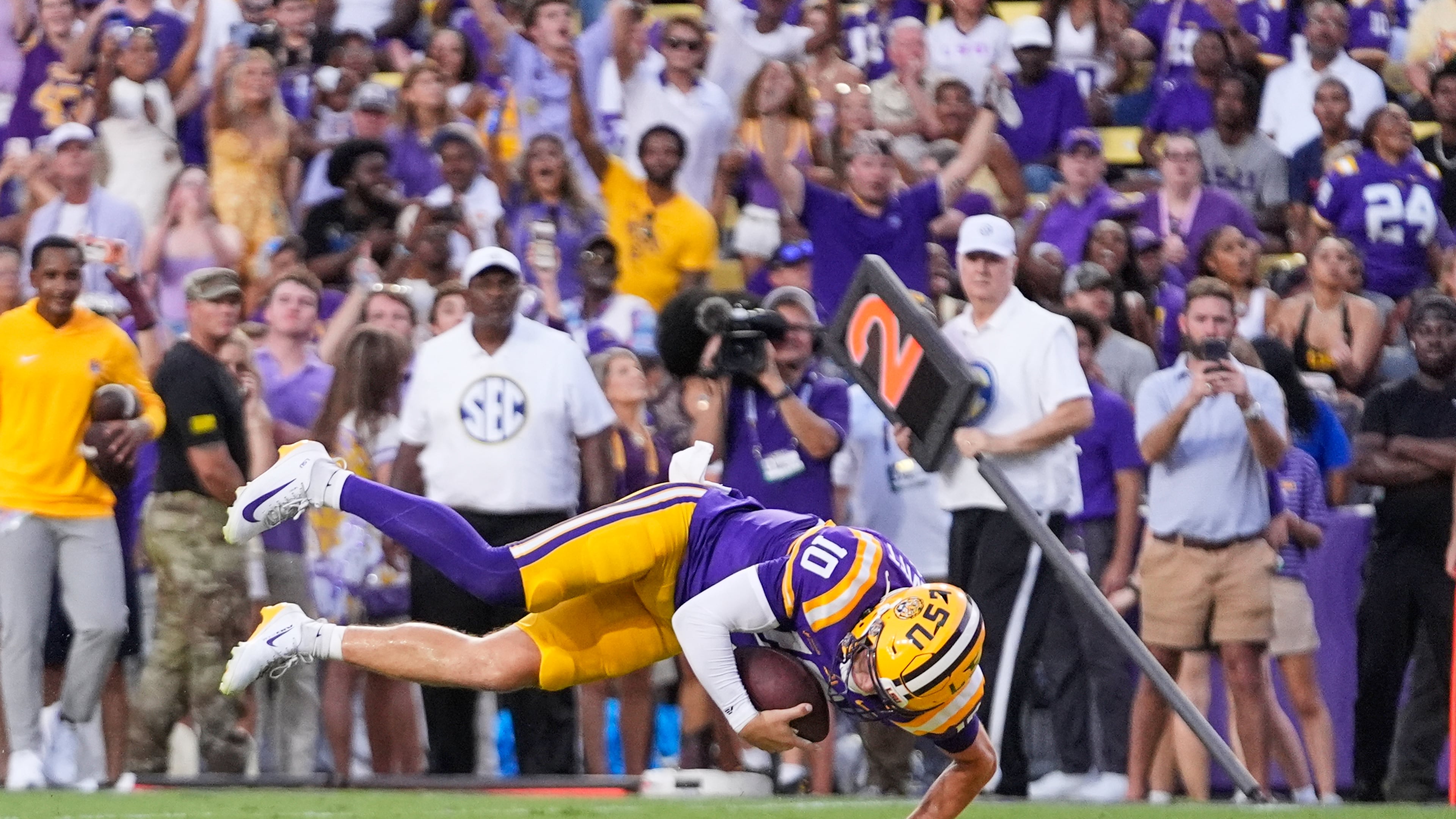 LSU quarterback Sam Leavitt (10) dives into the end zone on a touchdown carry against Louisiana Tech in the first half of an NCAA college football game, Saturday, Sept. 12, 2026 in Baton Rouge, La. (AP Photo/Gerald Herbert)