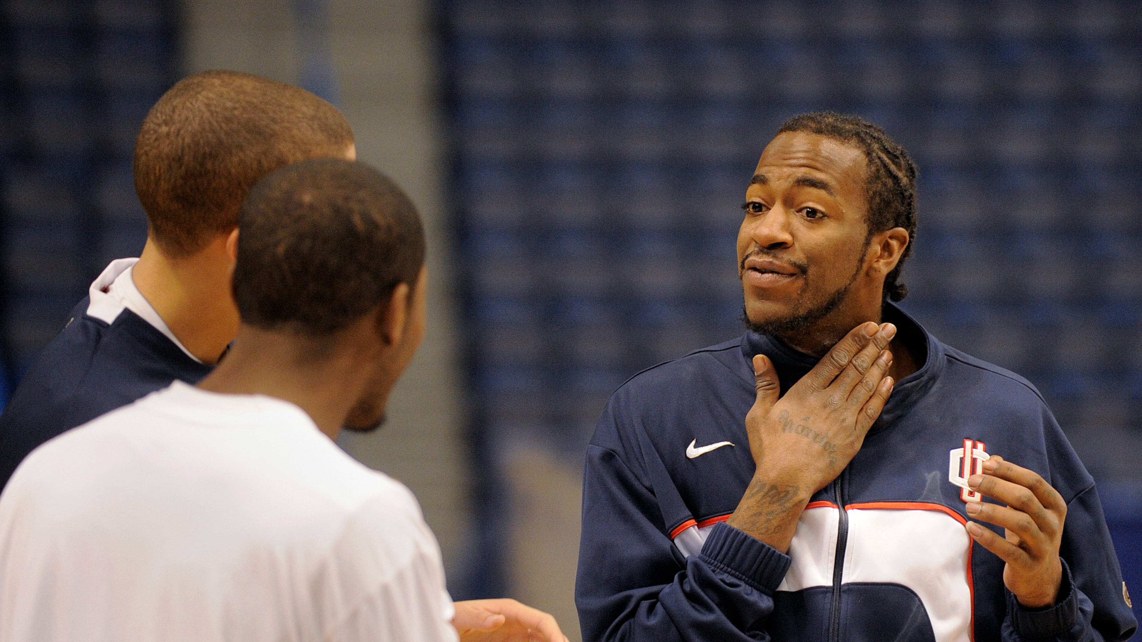 FILE - In 2010, Connecticut's Stanley Robinson, right, jokes with teammates Gavin Edwards and Jerome Dyson during warmups before their NCAA college baksetball game against Pittsburgh in Hartford, Conn..