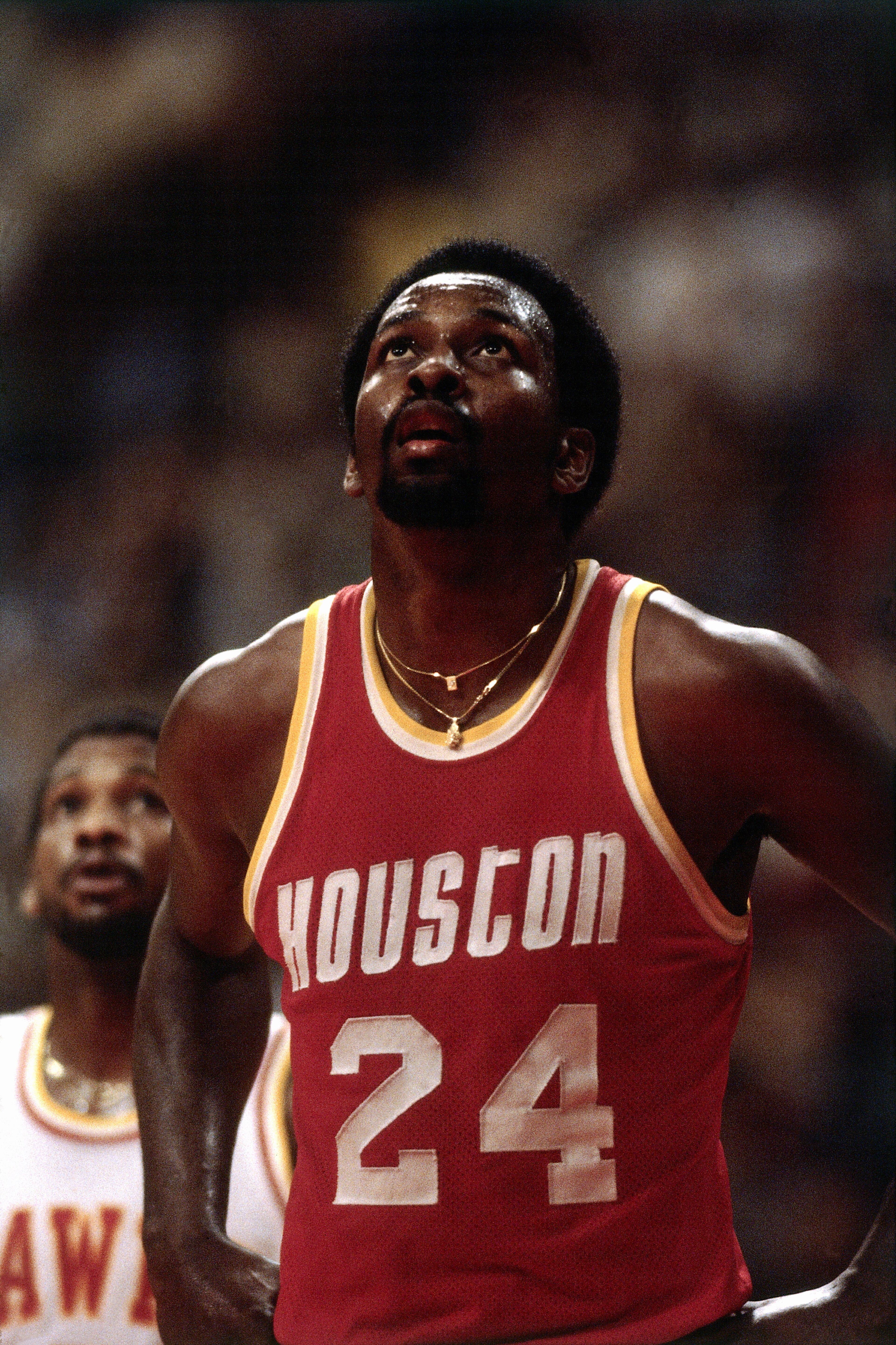 ATLANTA - 1979: Moses Malone #2 of the Houston Rockets looks up at the score board during a 1979 season NBA game against the Atlanta Hawks at the Omni in Atlanta, Georgia. NOTE TO USER: User expressly acknowledges and agrees that, by downloading and/or using this Photograph, user is consenting to the terms and conditions of the Getty Images License Agreement. Mandatory Copyright Notice: Copyright 1979 NBAE (Photo by Scott Cunningham/NBAE via Getty Images)