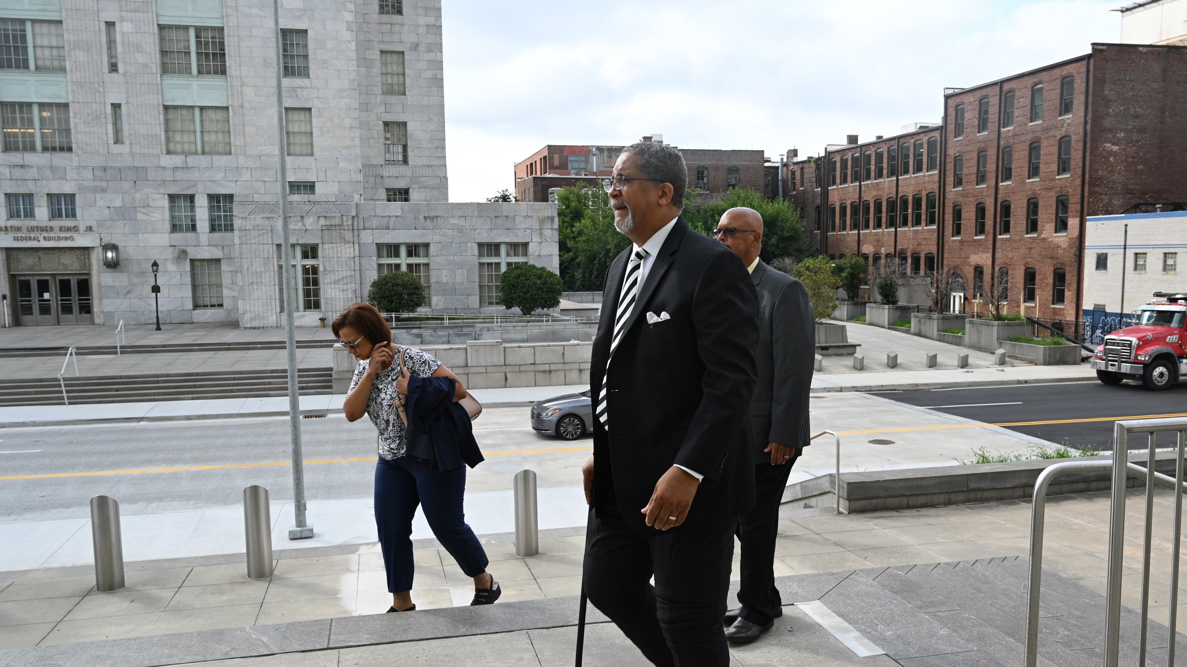 July 13 , 2022 Atlanta - Ex-Stonecrest mayor Jason Lary (right) arrives at the Richard B. Russell Federal Building for his sentencing hearing in federal fraud case related to misusing city’s COVID relief funds on Wednesday, July 13, 2022. (Hyosub Shin / Hyosub.Shin@ajc.com)