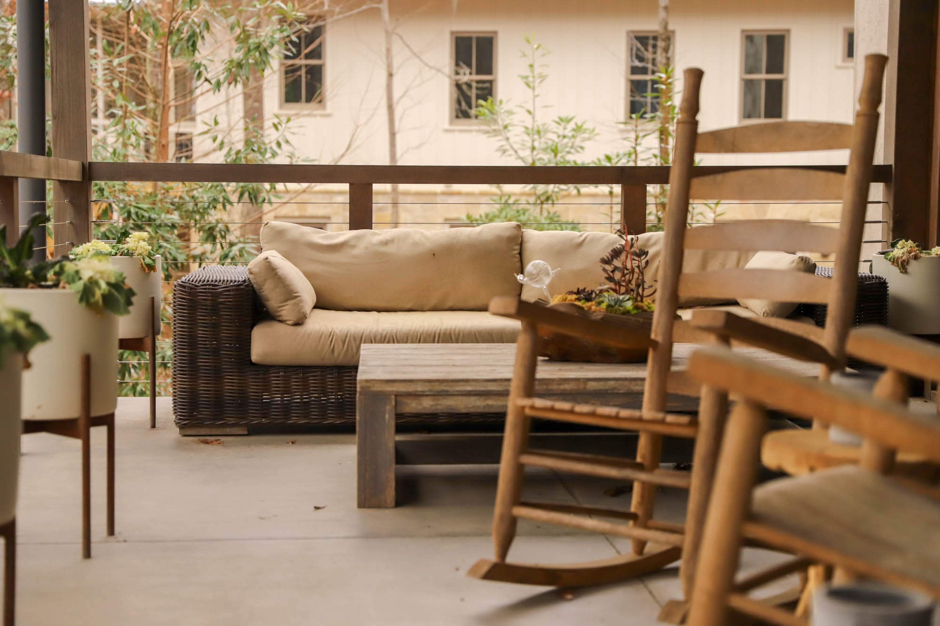 "We were over city life," said Heather Ruth. The empty-nesters decided to move to the community of Serenbe, just outside of Atlanta. Their outdoor porch offers plenty of seating for guests.