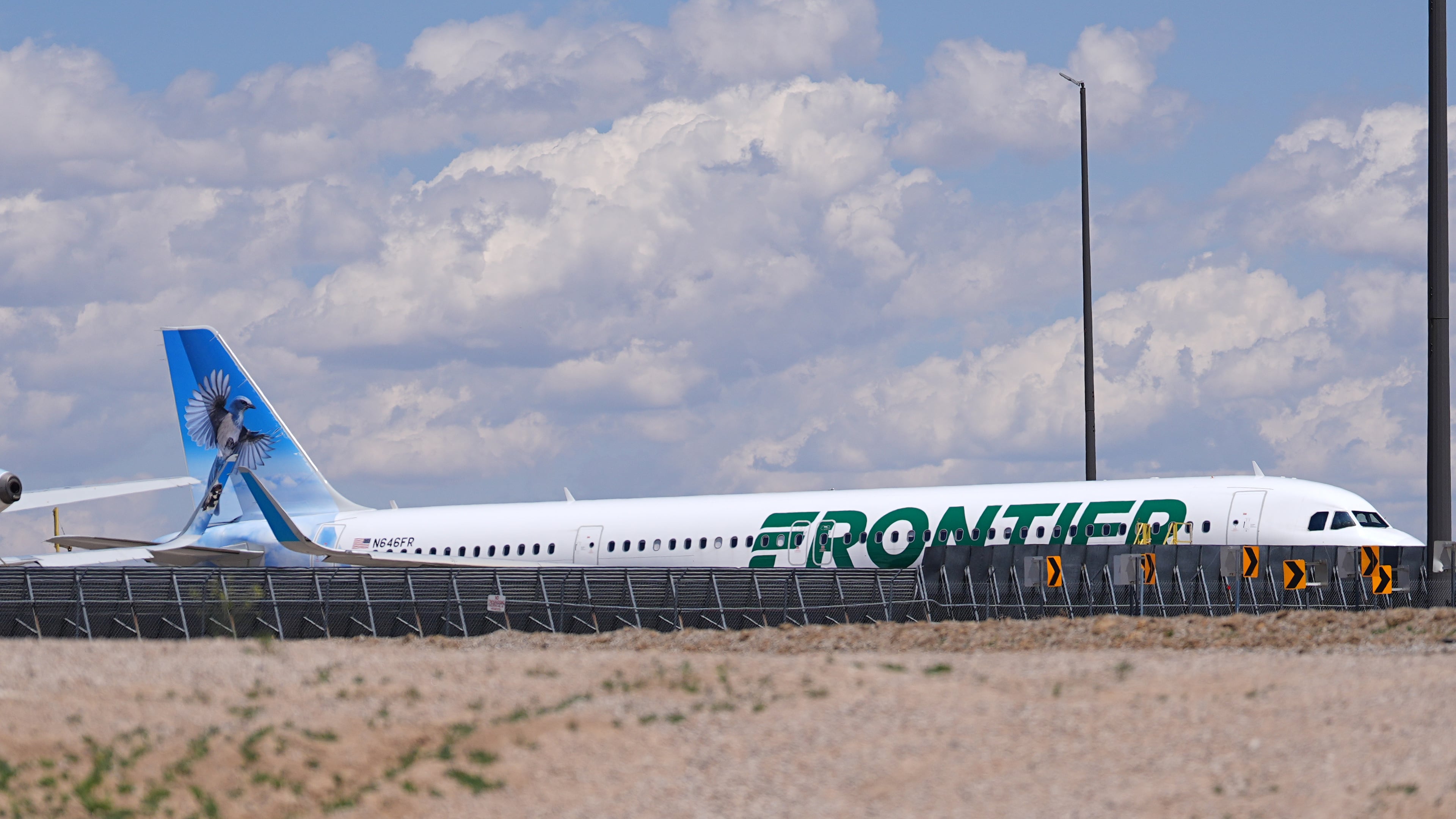 Frontier Airlines jetliner number n646fr sits outside the airlines technical operations center with other jetliners in for service north of Denver International Airport Saturday, May 9, 2026, in Denver. (AP Photo/David Zalubowski)