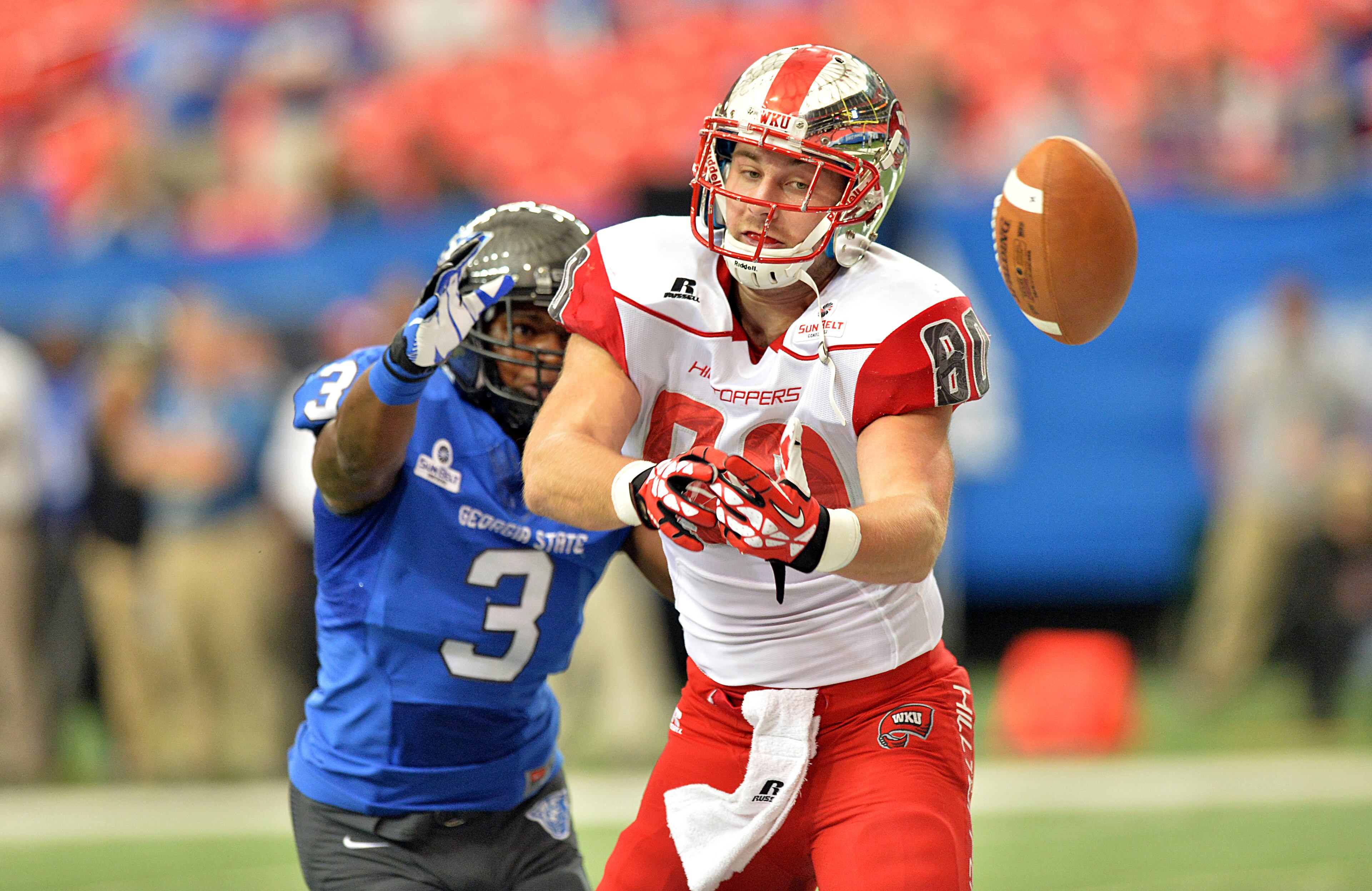 Western Kentucky Hilltoppers tight end Mitchell Henry (80) can't catch a pass as Georgia State Panthers linebacker Tarris Batiste (3) follows in the first half at the Georgia Dome on Saturday, November 2, 2013.