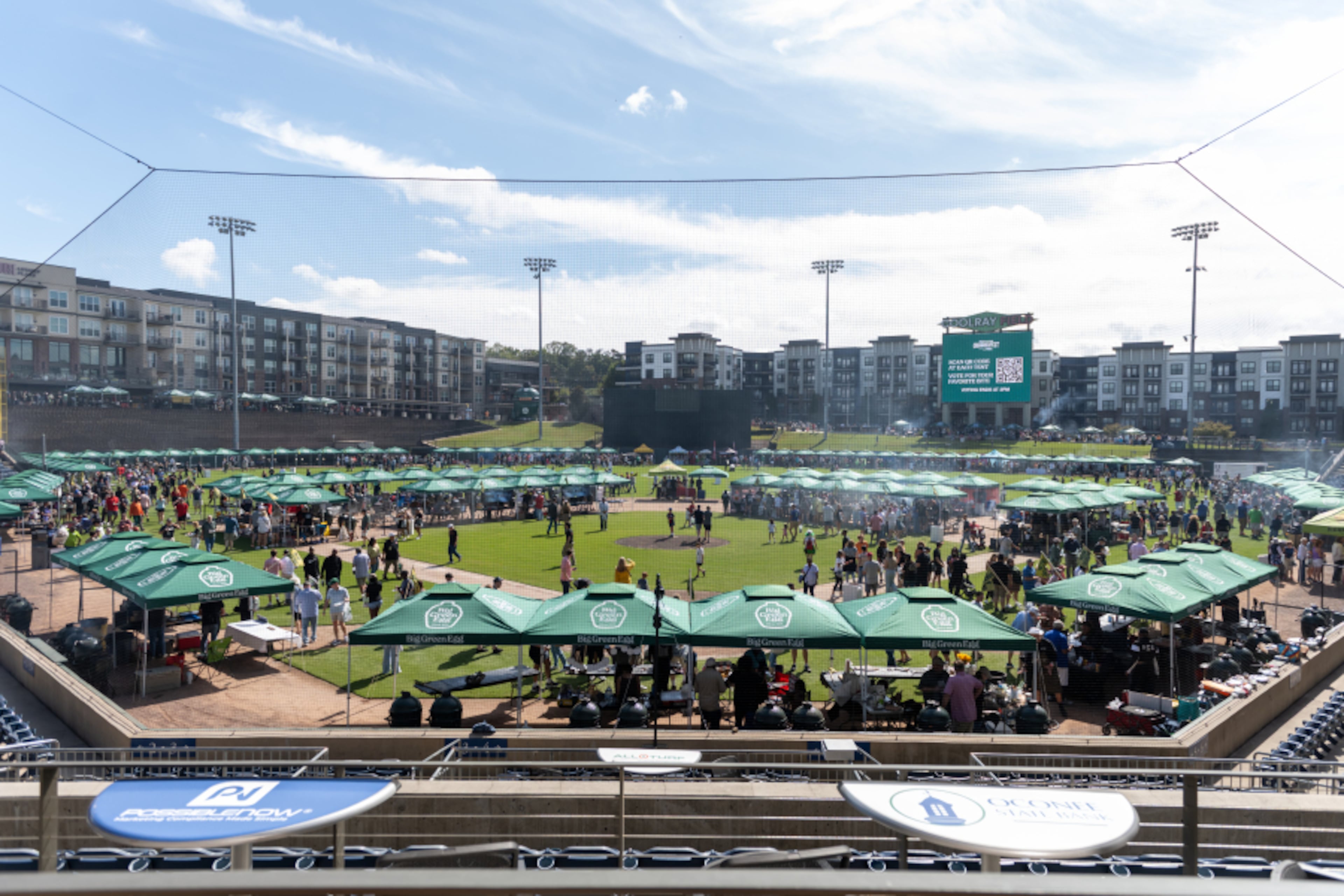 Hundreds of Big Green Egg cookers line the outfield concourse at Gwinnett Field in Lawrenceville as thousands of attendees gather for the annual EGGtoberfest festival. (Courtesy of Mud Films)