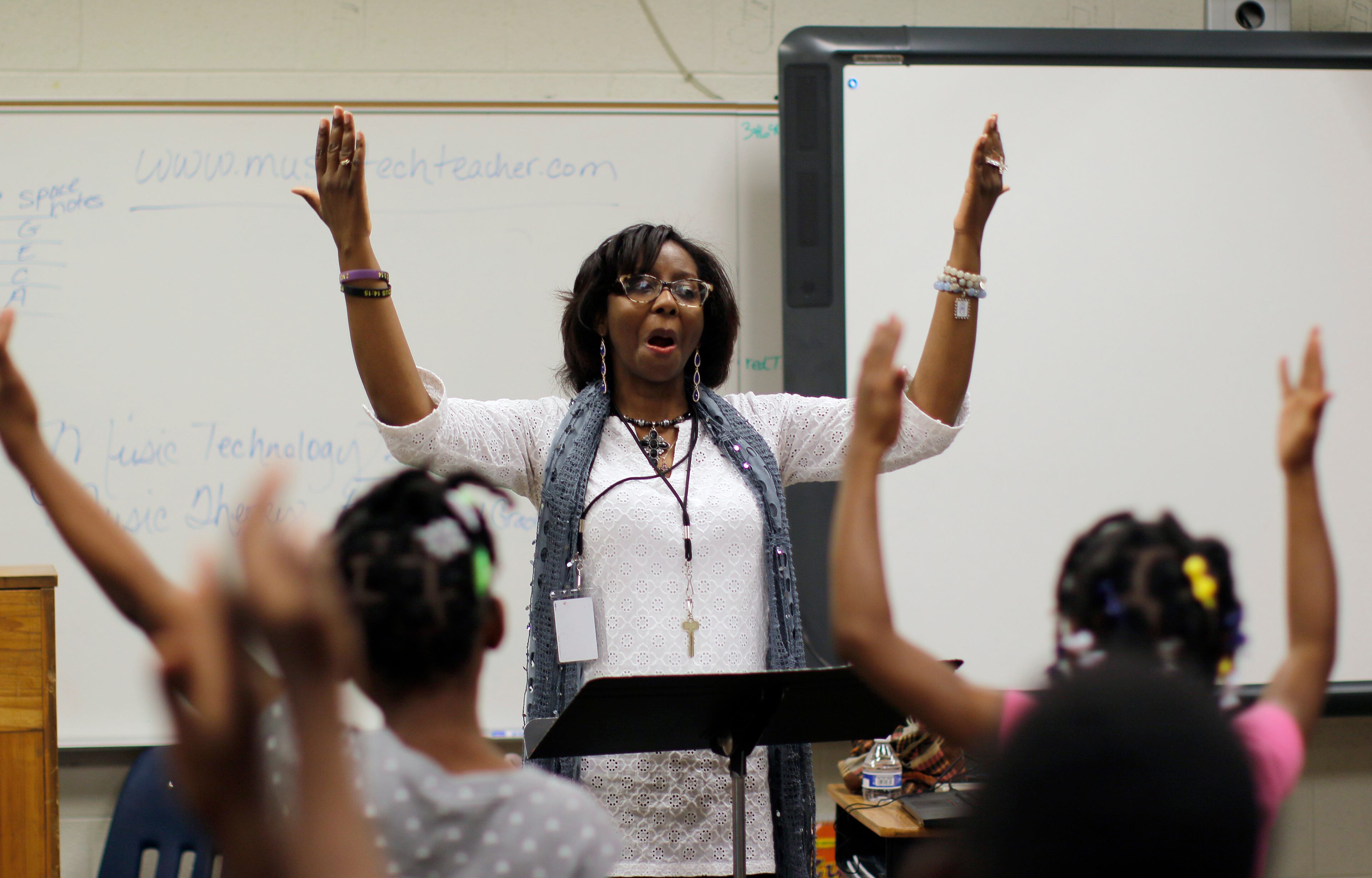 Third graders practice in Letricia Henson's music and chorus class. Thomasville Heights Elementary School is the first school to be part of APS' outsourcing experiment. A group called Purpose Built Schools took over the school this year. Among the changes at Thomasville are intensive instruction in reading/math; pre-K programs; daily "specials" including dance and robotics and a team of parents working at the school to better connect staff with the community BOB ANDRES /BANDRES@AJC.COM