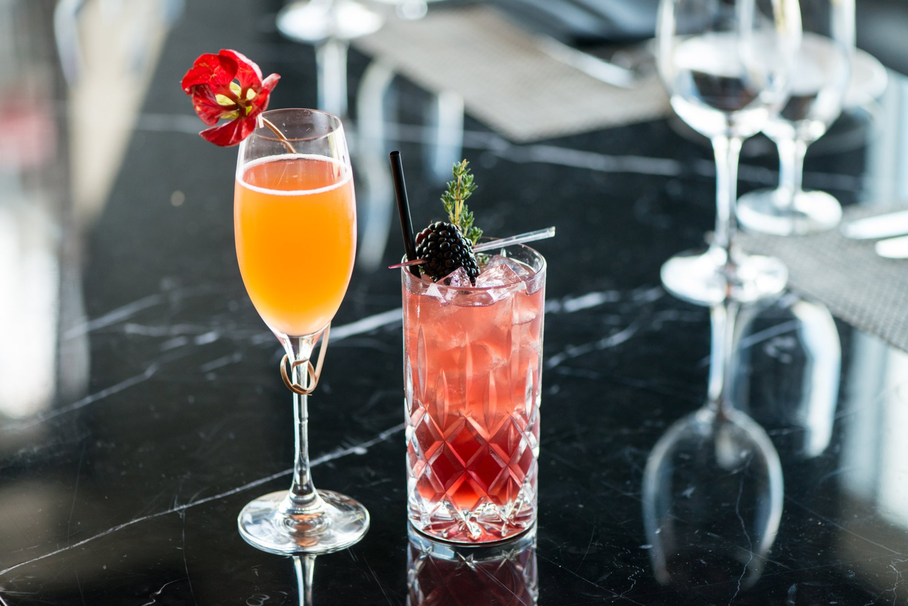 Double Eagle Steakhouse cocktails Pamplemousse Spritz (left) and Sapphire Bramble (right). Photo credit- Mia Yakel.