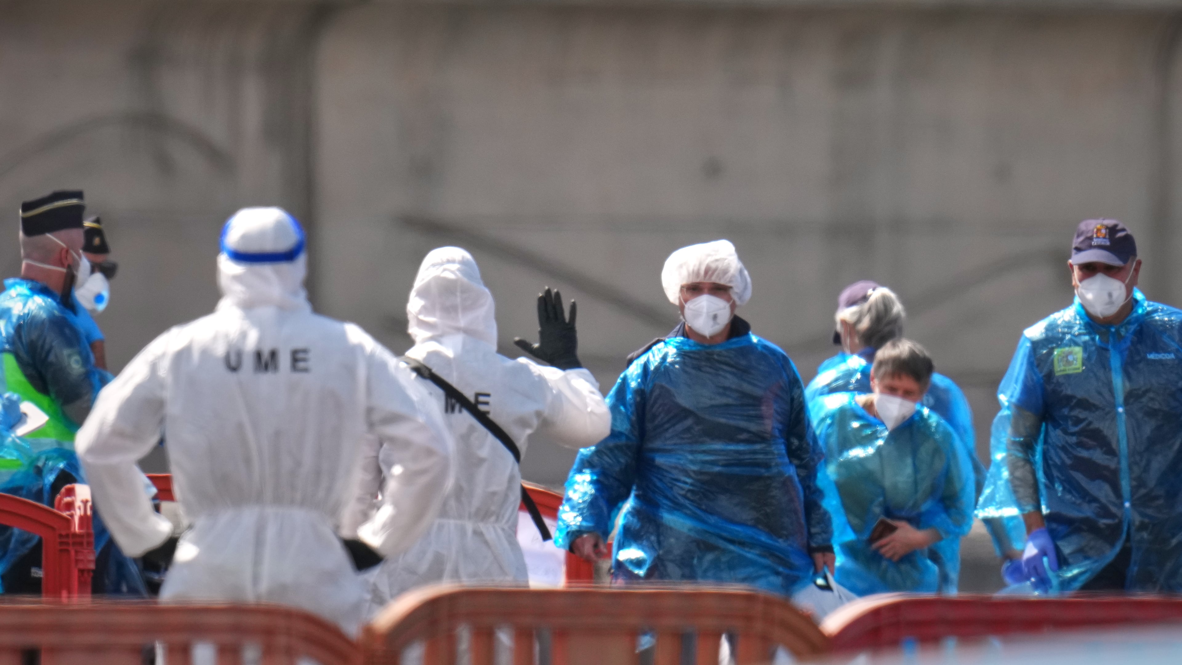 Passengers are disembarked from the hantavirus-stricken cruise ship MV Hondius at the port of Granadilla in Tenerife, Canary Islands, Spain, Sunday, May 10, 2026. (AP Photo/Manu Fernandez)