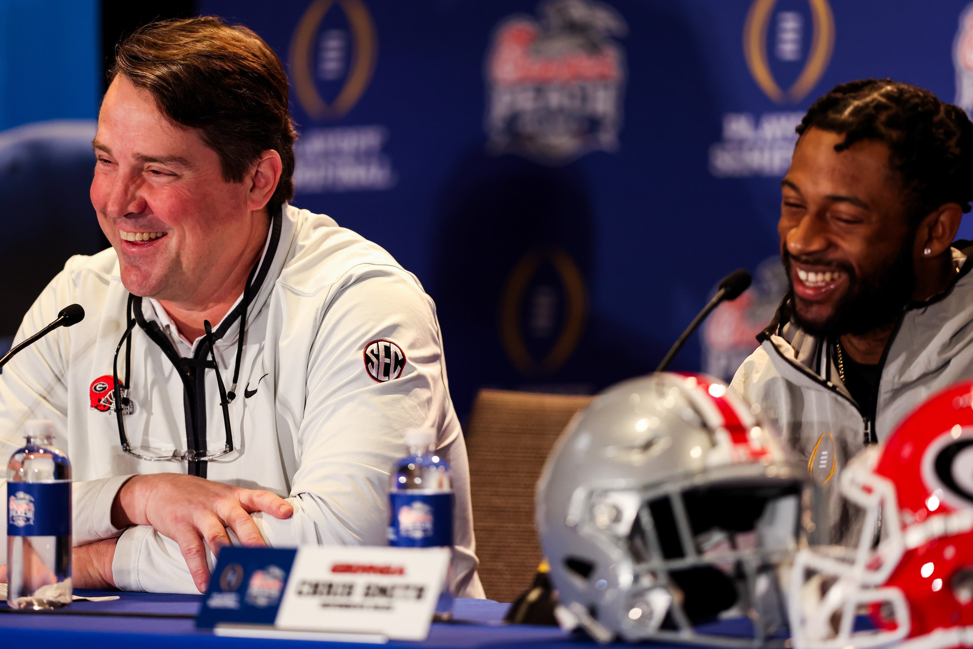 Georgia co-defensive coordinator Will Muschamp (left) and safety Chris Smith speak during a press conference on Tuesday, Dec. 27, 2022. Georgia will face Ohio State in the 2022 College Football Playoff Semifinal at the Chick-fil-A Peach Bowl. (Jason Parkhurst via Abell Images for the Chick-fil-A Peach Bowl)