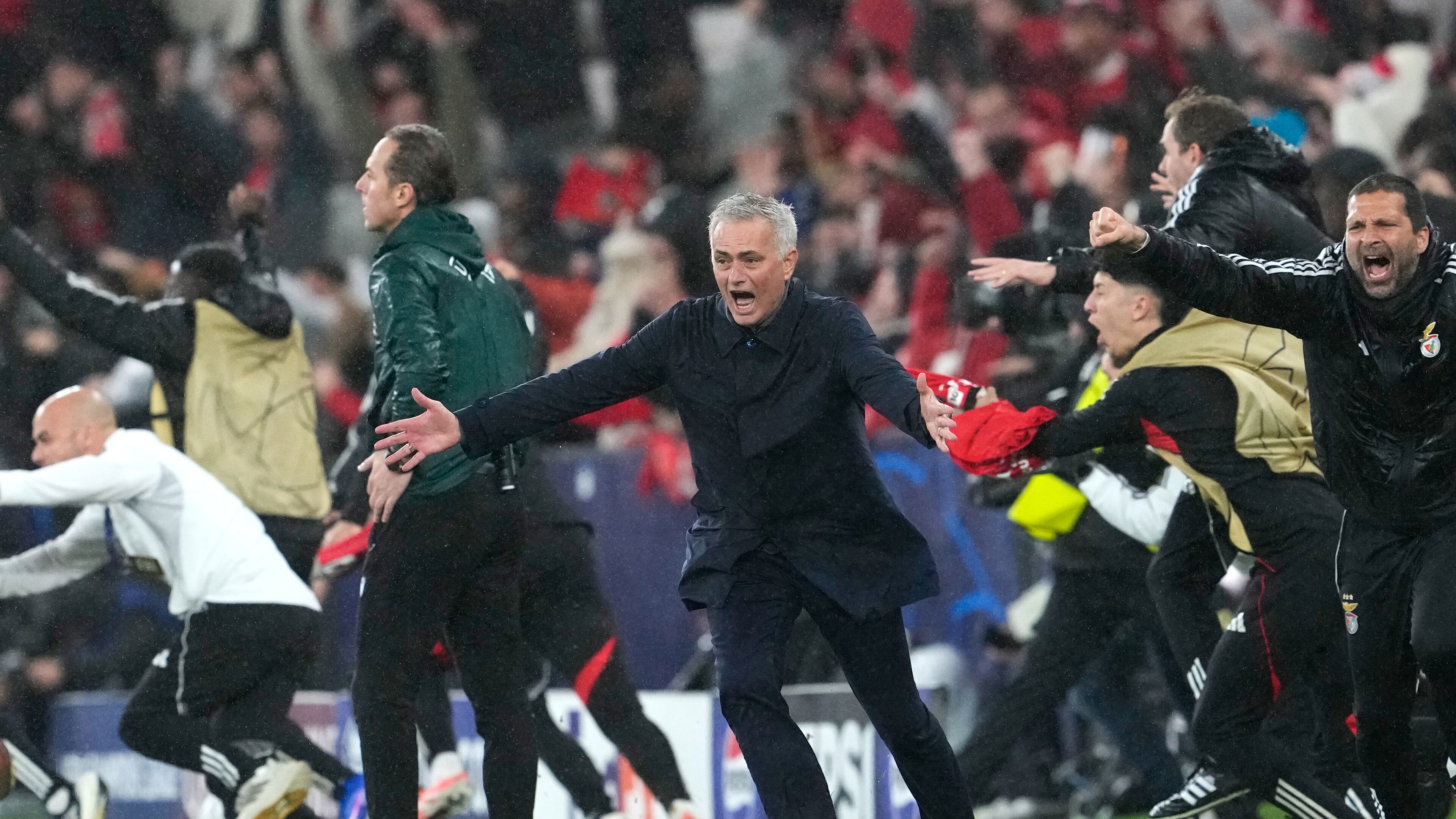 Benfica's head coach Jose Mourinho runs celebrating at the end of a Champions League opening phase soccer match between Benfica and Real Madrid, in Lisbon, Wednesday, Jan. 28, 2026. (AP Photo/Armando Franca)