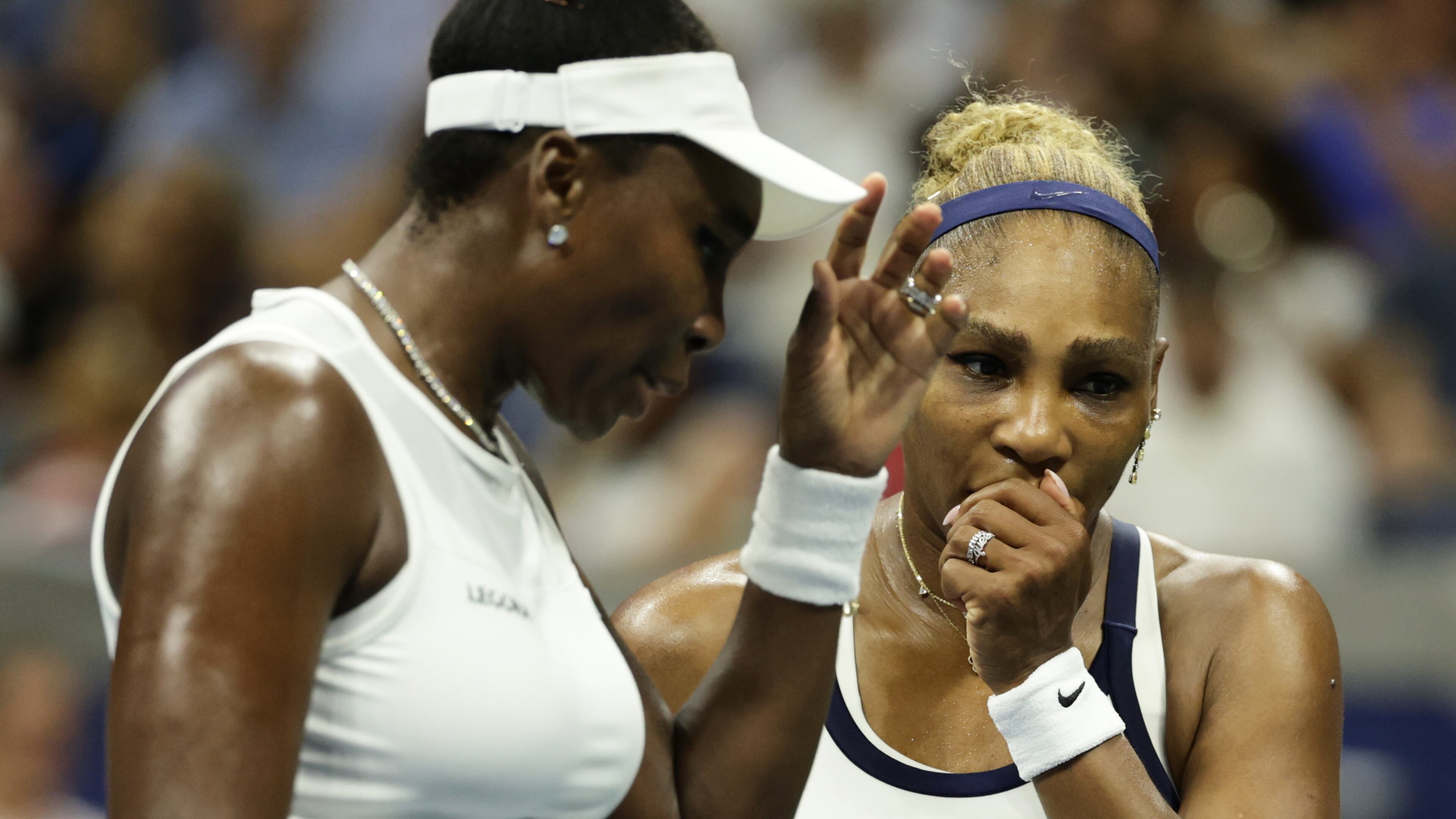 Venus Williams, left, and Serena Williams, of the United States, confer as they play against Hao-Ching Chan, of Taiwan, and Maya Joint, of Australia, during a women's doubles match at the U.S. Open tennis championships, Friday, Sept. 4, 2026, in New York. (AP Photo/Adam Hunger)