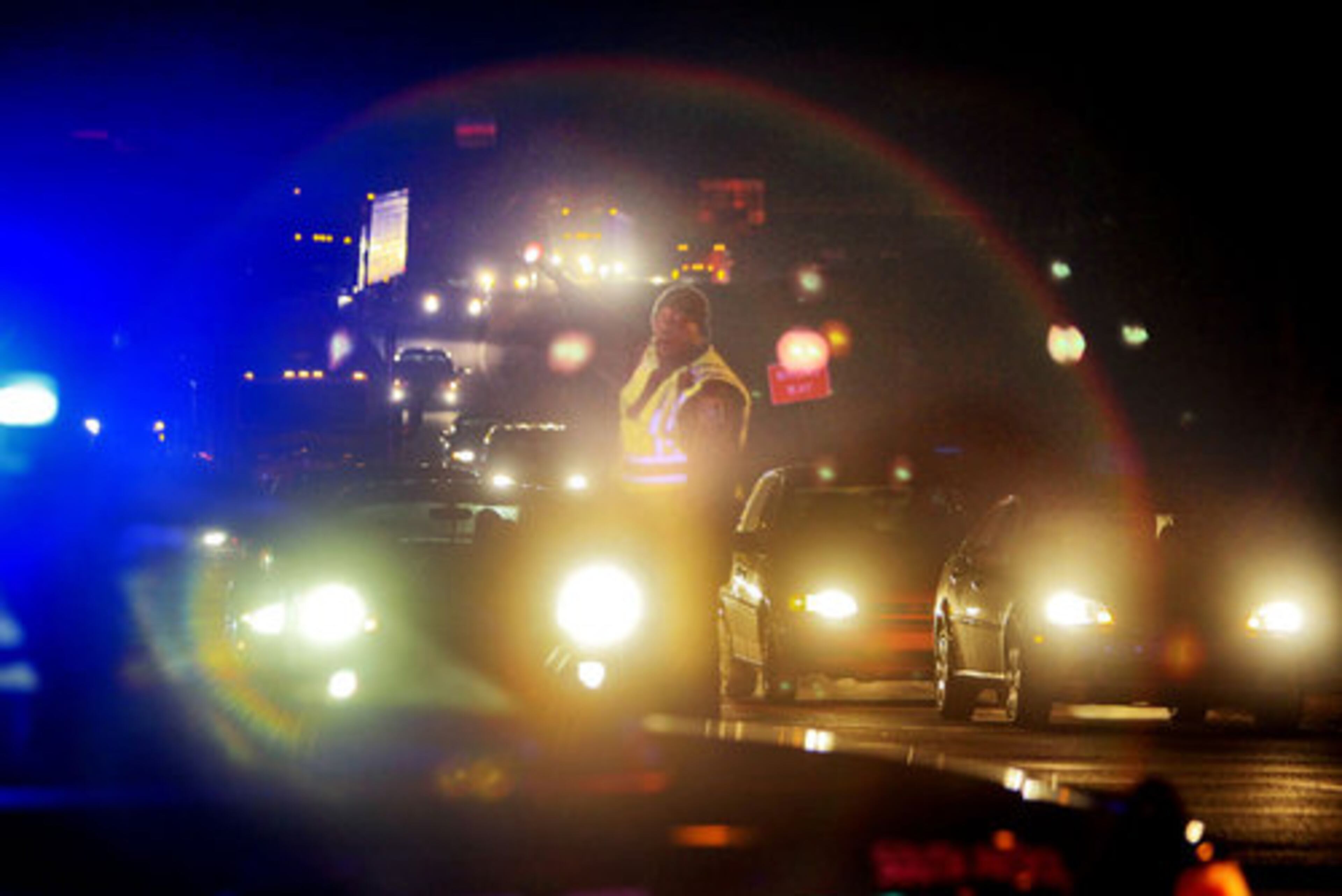 Fulton County police direct traffic at the on-ramp to I-285 south at Cascade Road, where traffic was diverted Wednesday. All southbound lanes of I-285 in south Fulton County were shut down early Wednesday, Feb 9, 2011, after a body was discovered on the interstate.