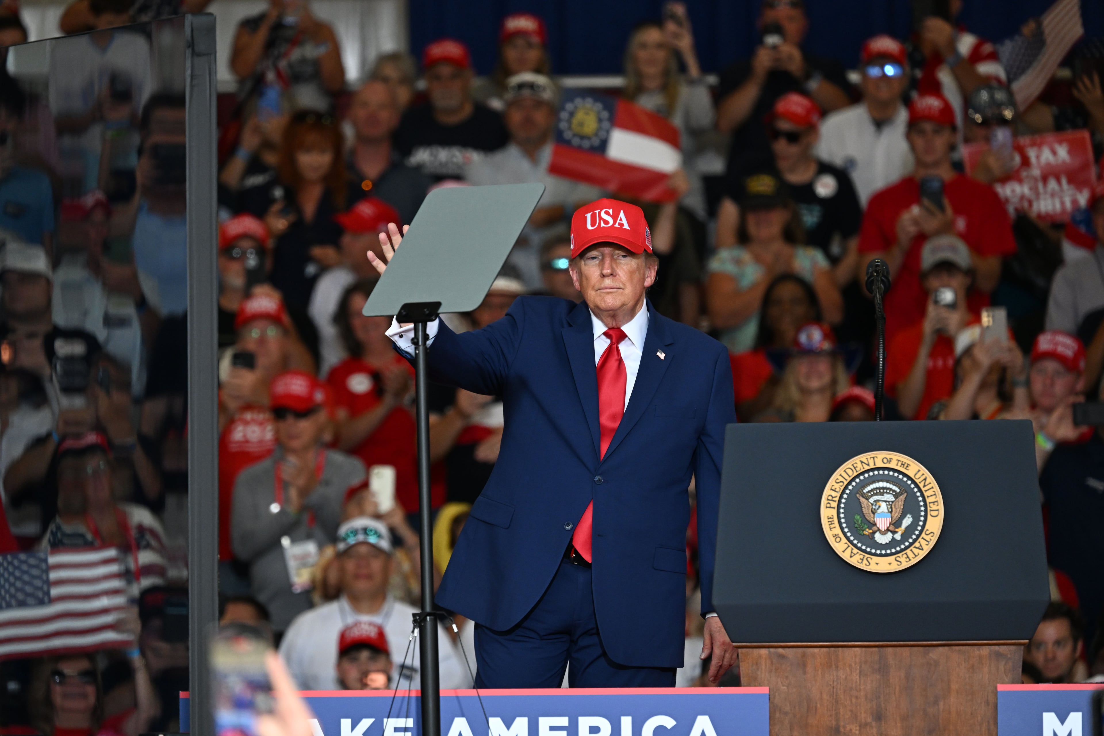 President Donald Trump waves to supporters as he leaves the stage at the end of a campaign rally at Dalton Municipal Airport on Friday, Oct. 16, 2026, in Dalton. (Hyosub Shin/AJC)