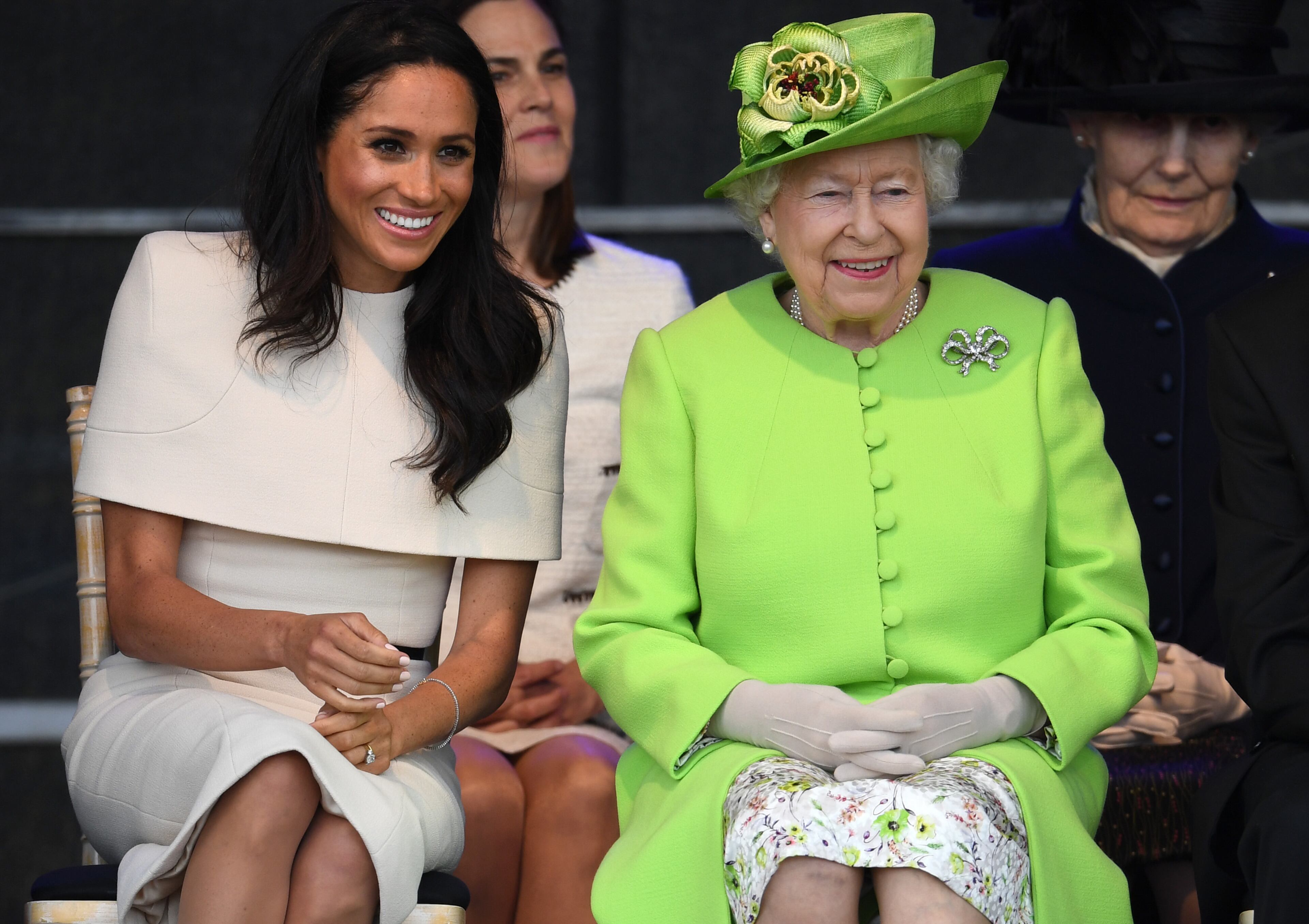 WIDNES, ENGLAND - JUNE 14: Queen Elizabeth II sits with Meghan, Duchess of Sussex during a ceremony to open the new Mersey Gateway Bridge on June 14, 2018 in the town of Widnes in Halton, Cheshire, England. Meghan Markle married Prince Harry last month to become The Duchess of Sussex and this is her first engagement with the Queen. During the visit the pair will open a road bridge in Widnes and visit The Storyhouse and Town Hall in Chester. (Photo by Jeff J Mitchell/Getty Images)